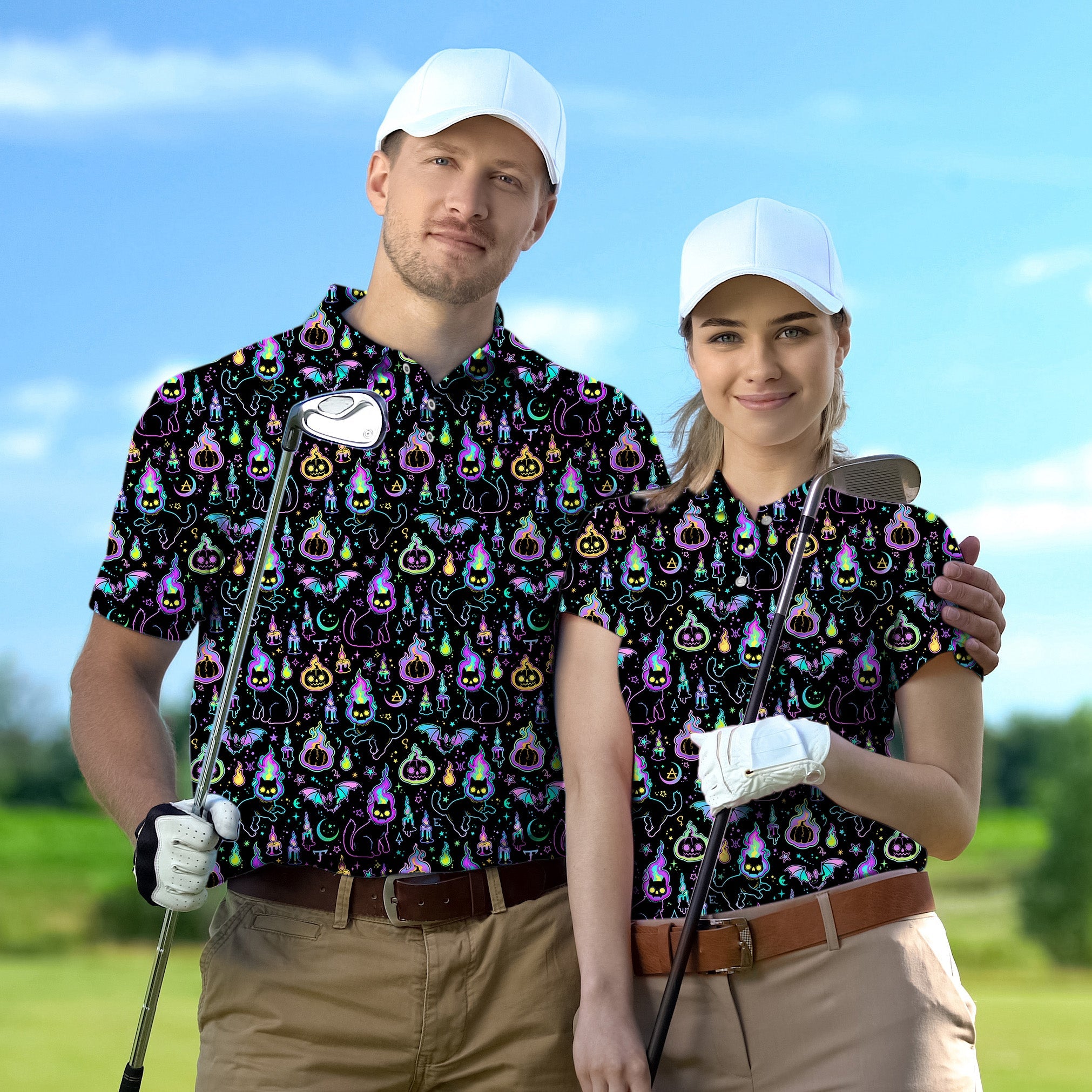 Couple wearing Halloween ghost and pumpkin themed golf shirts holding clubs on course