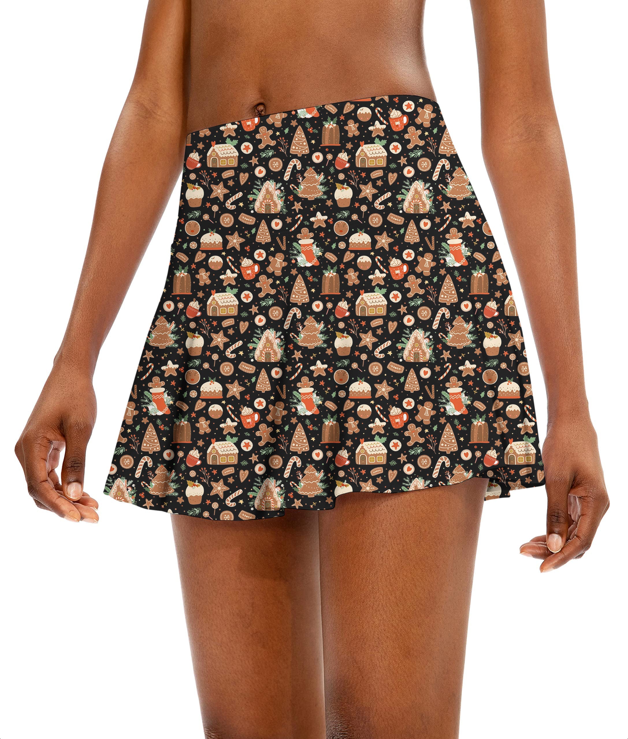 Black Christmas Candy House women's athletic golf skort with festive candy house pattern and flared design