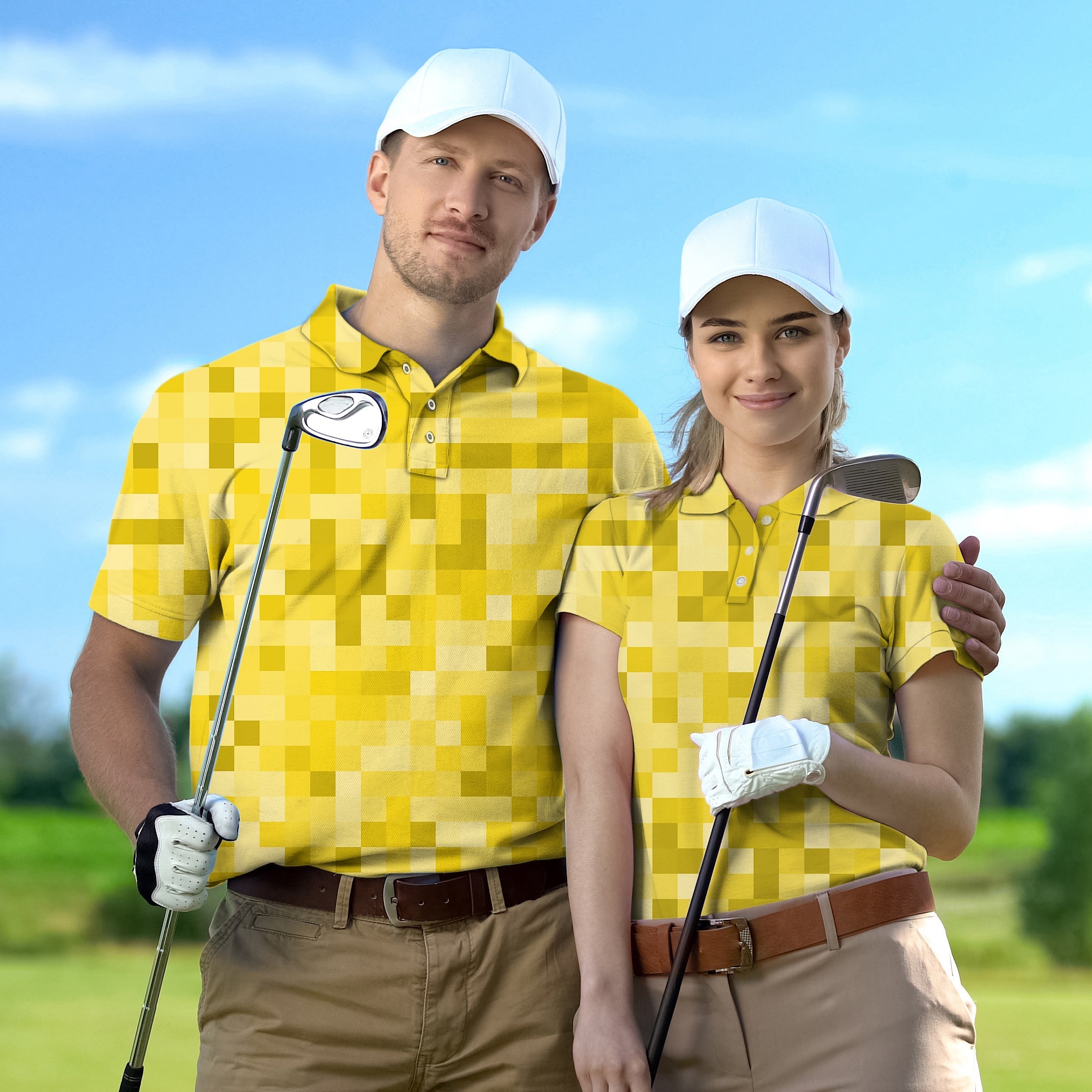 Couple wearing yellow pixel pattern golf shirts with white caps holding golf clubs on course