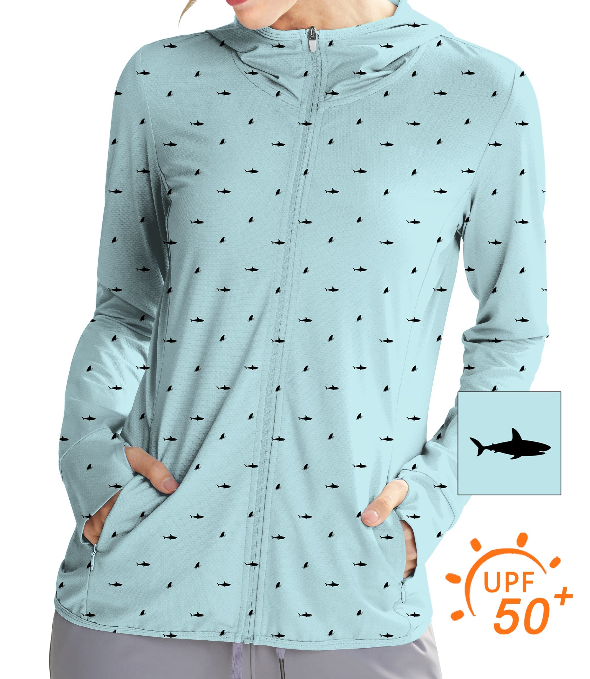 Women's slim fit light blue zip hoodie with black shark and fin print, UPF 50+ sun protection, thumb holes, and breathable fabric for outdoor activities