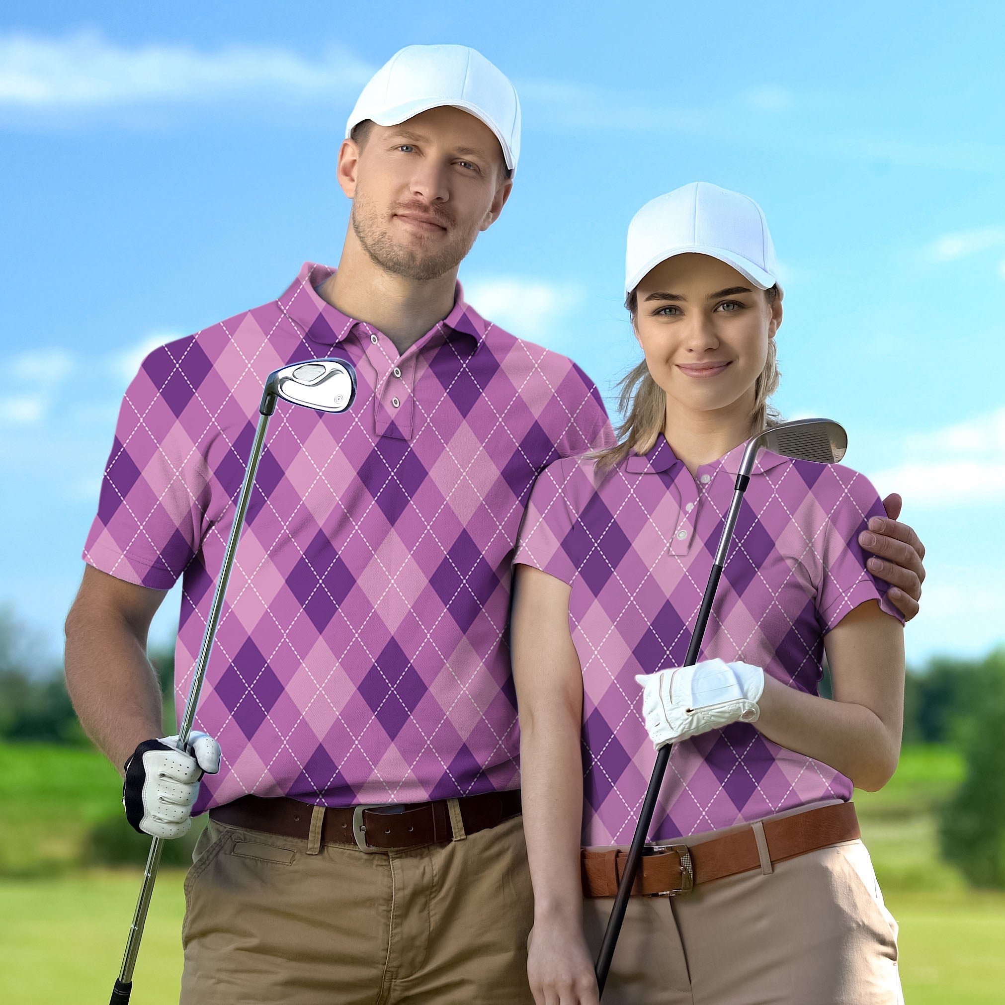 Couple wearing purple argyle golf shirts holding clubs on golf course for Golf Championship Trophy tournament