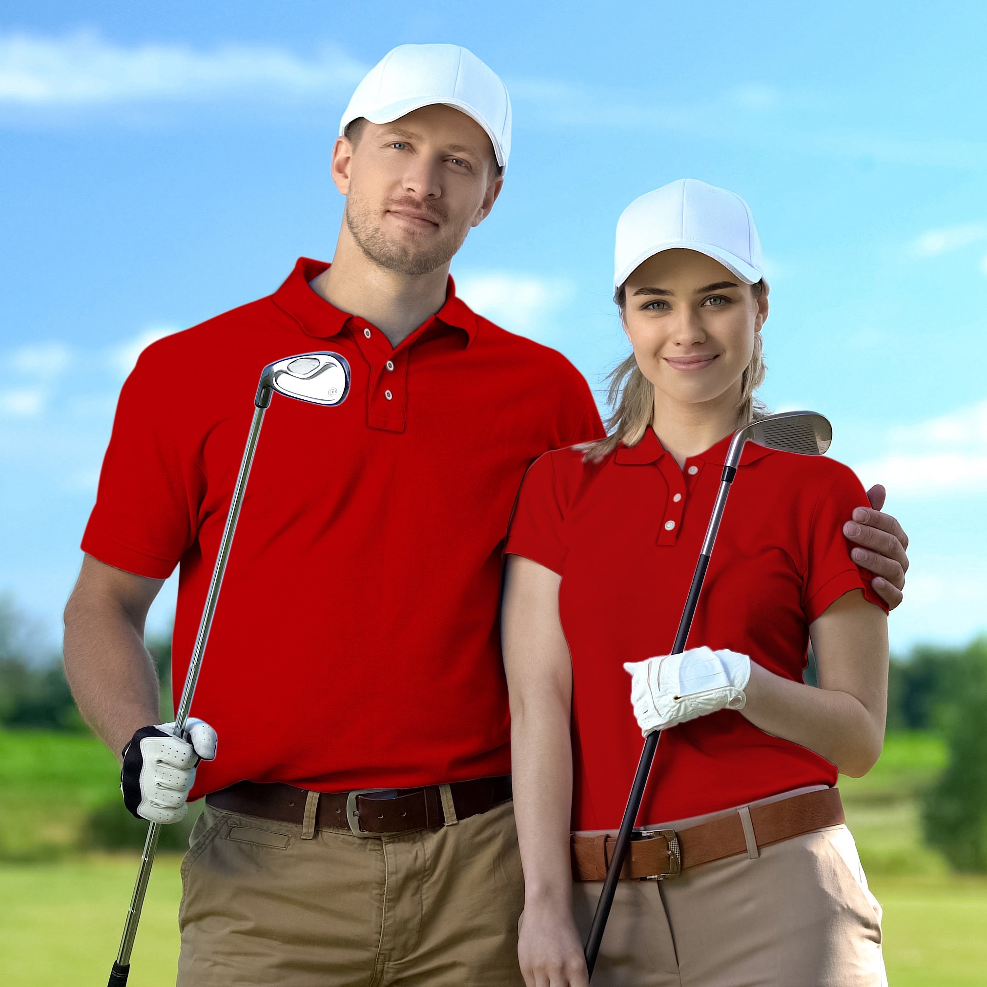 couple wearing pure festive set red golf shirts with white caps holding golf clubs on golf course