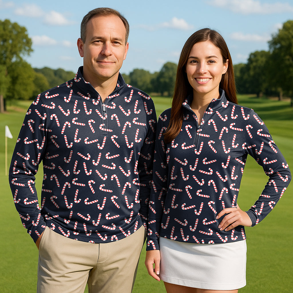 Couple wearing Christmas candy stick golf active 3/4 zip tops with long sleeves on a golf course