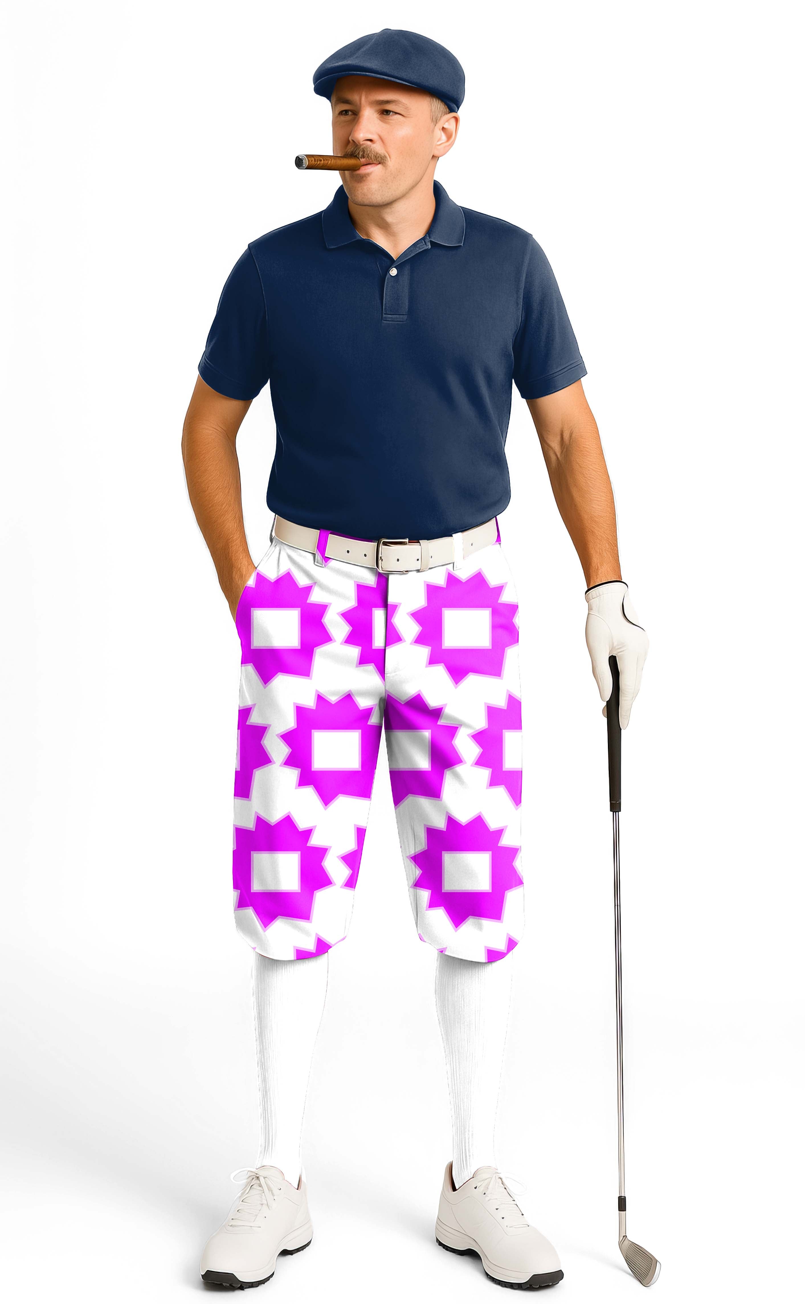 Man wearing Explosion Geometry limited edition men's golf knickers with pink and white geometric pattern, navy polo, white golf gloves, and cap holding a golf club.