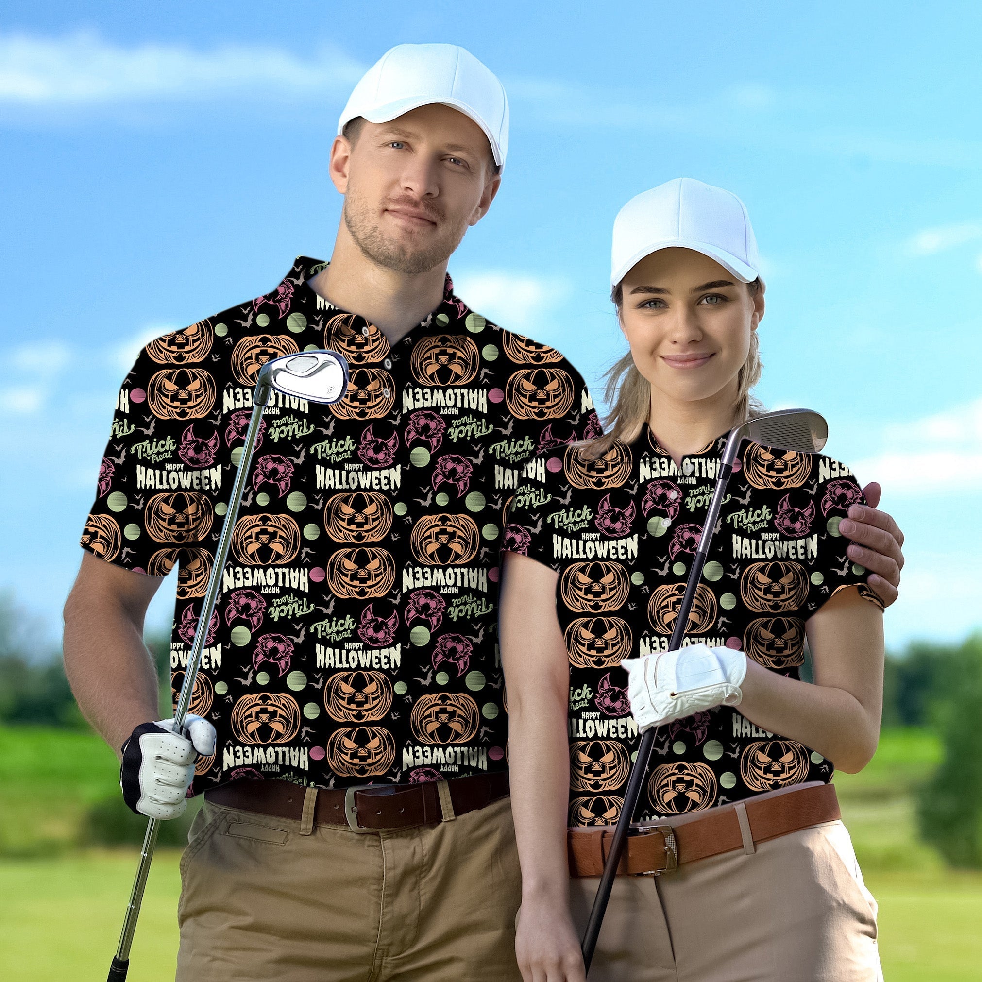 couple wearing happy Halloween themed golf shirts with pumpkin and skull designs playing golf outdoors