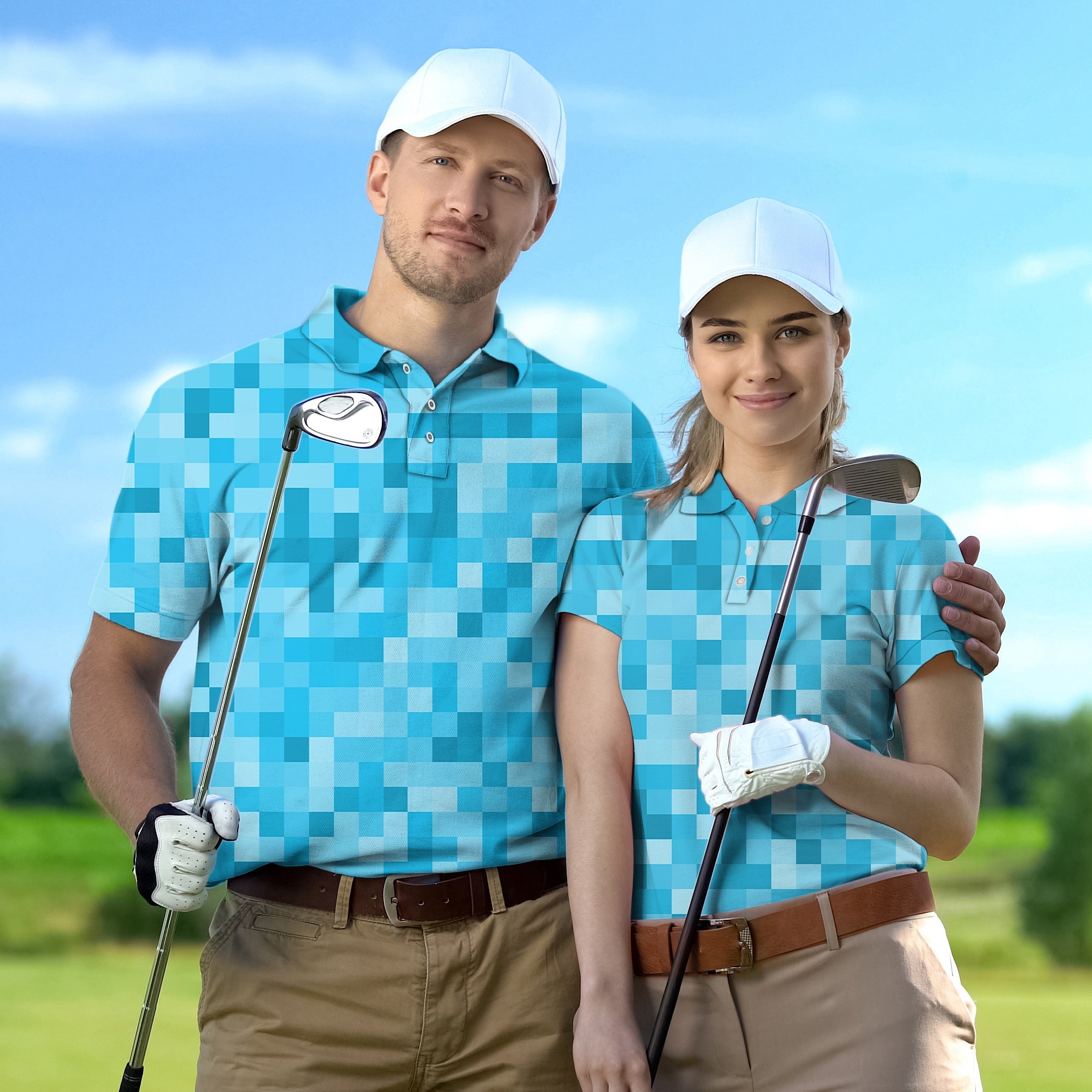 Couple wearing blue pixel pattern golf shirts with white caps holding golf clubs on course