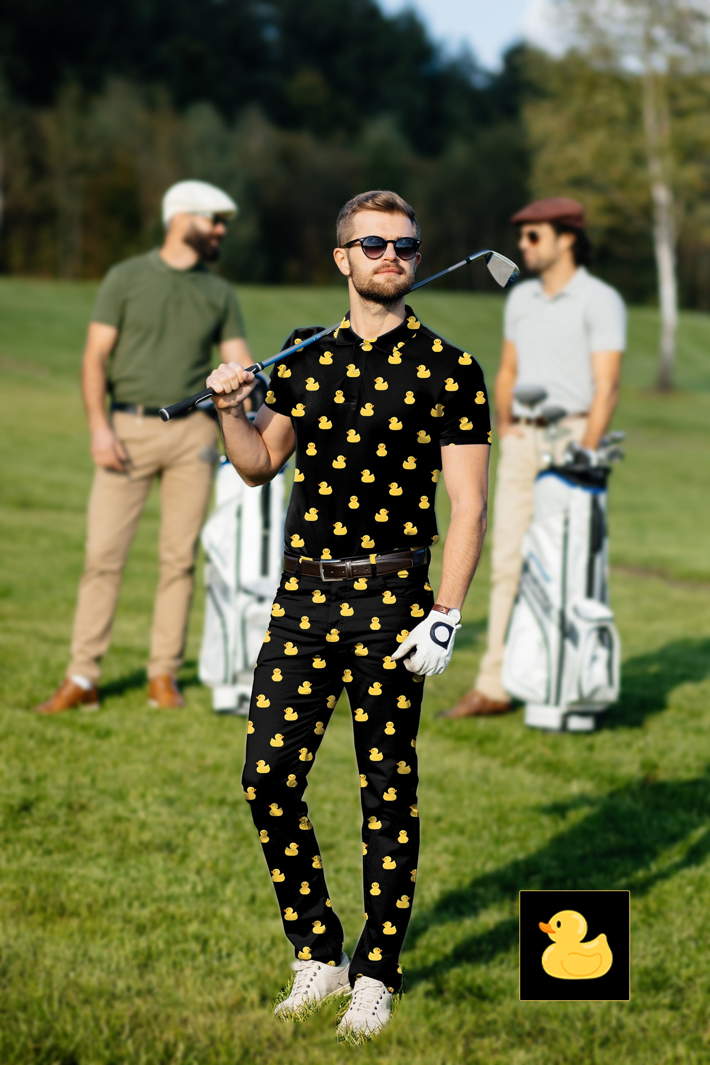 Men's golf set with yellow rubber duck print polo and pants on golf course