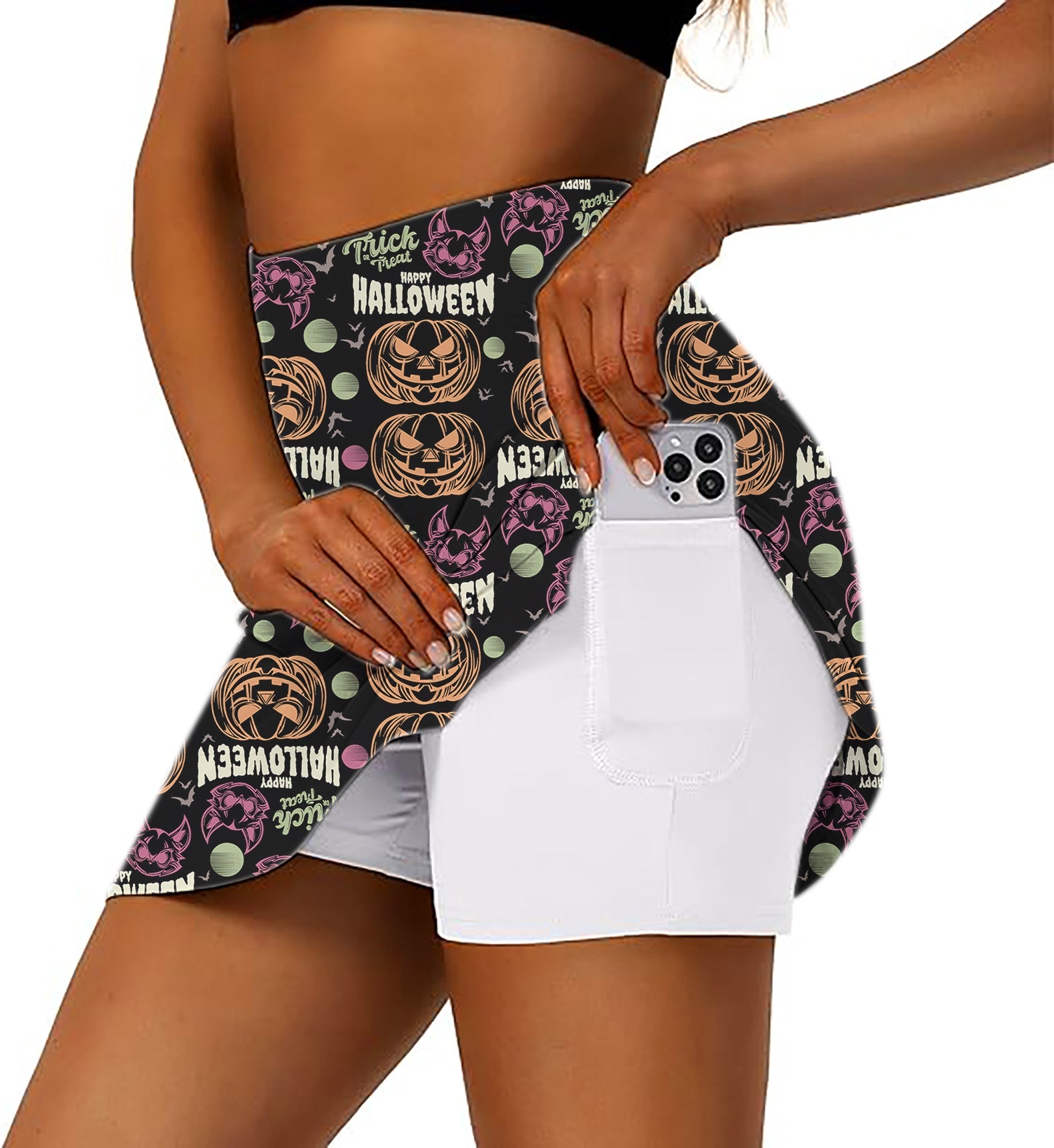 Women's Happy Halloween colorful pumpkin golf skirt with inner shorts and pocket holding phone