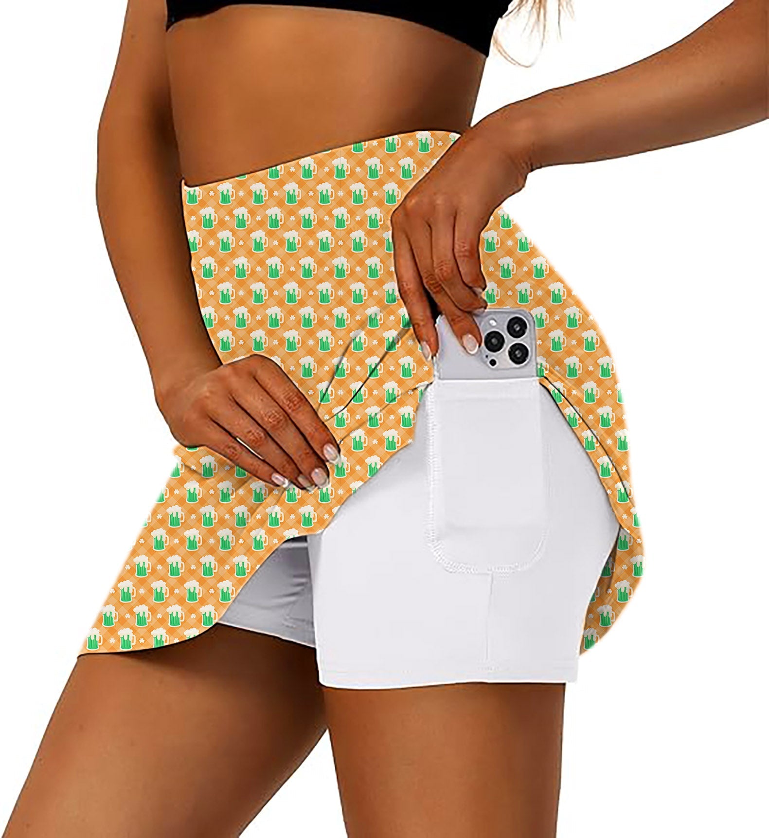 Women's athletic golf skort with green beer and clover leaf pattern and side pocket for phone