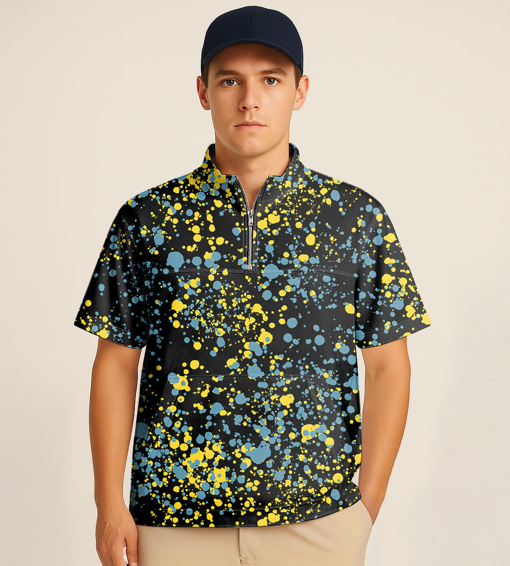 Half zipper turtleneck golf shirt with blue and yellow paint splatter embroidery worn by male model.