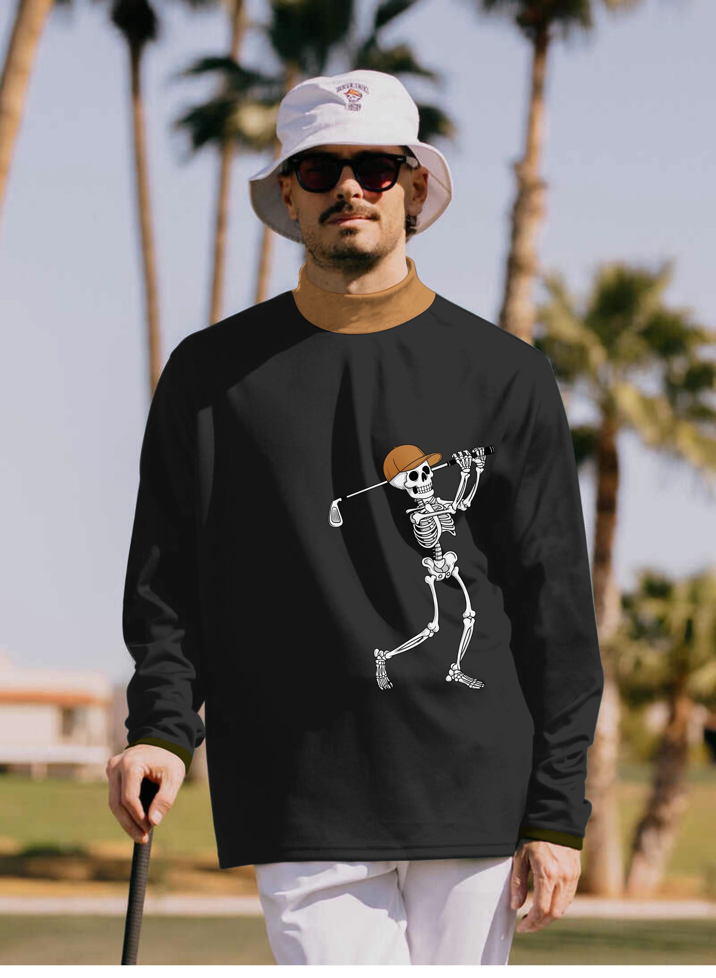 Men's Pumpkin Black Halloween skeleton golf pullover with high neck and long sleeves modeled outdoors