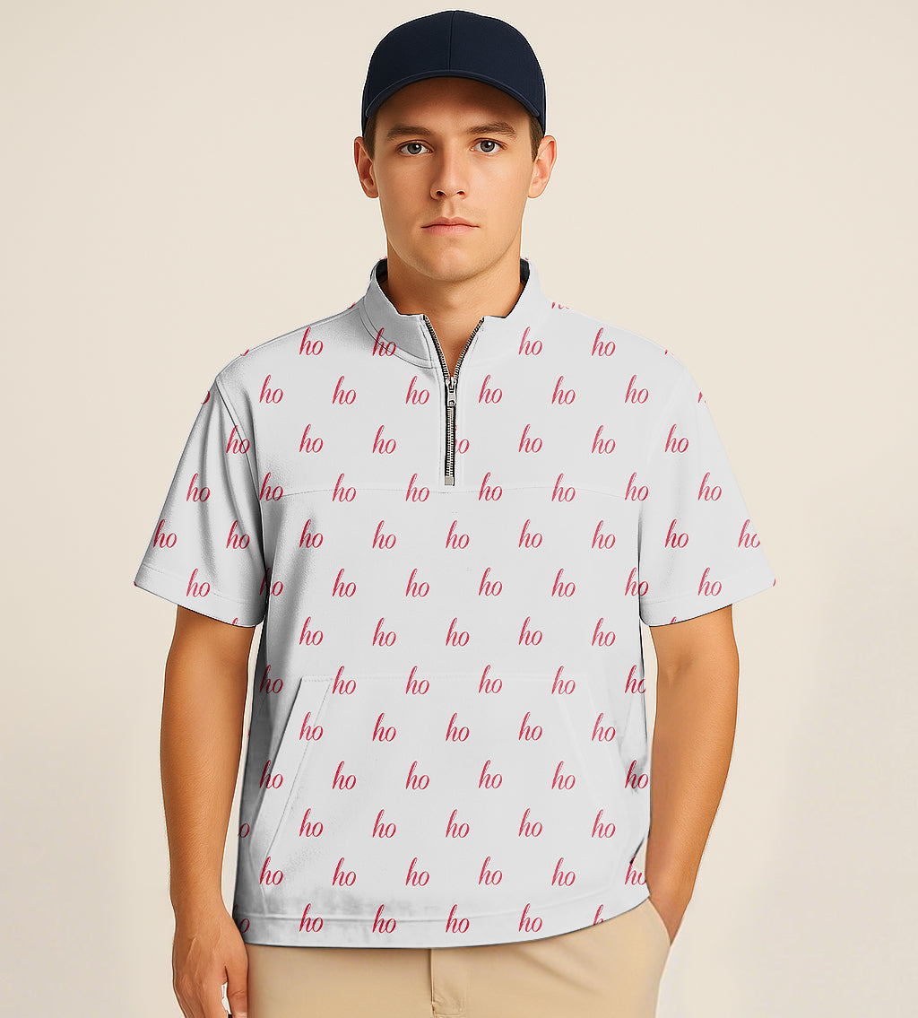 Man wearing grey half zipper turtleneck golf short shirt with red Christmas "ho" embroidery and navy cap