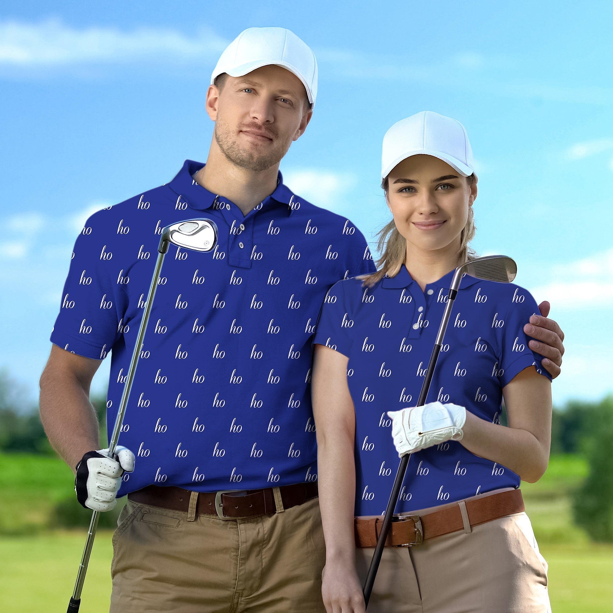 Couple wearing blue custom name golf shirts holding clubs on course