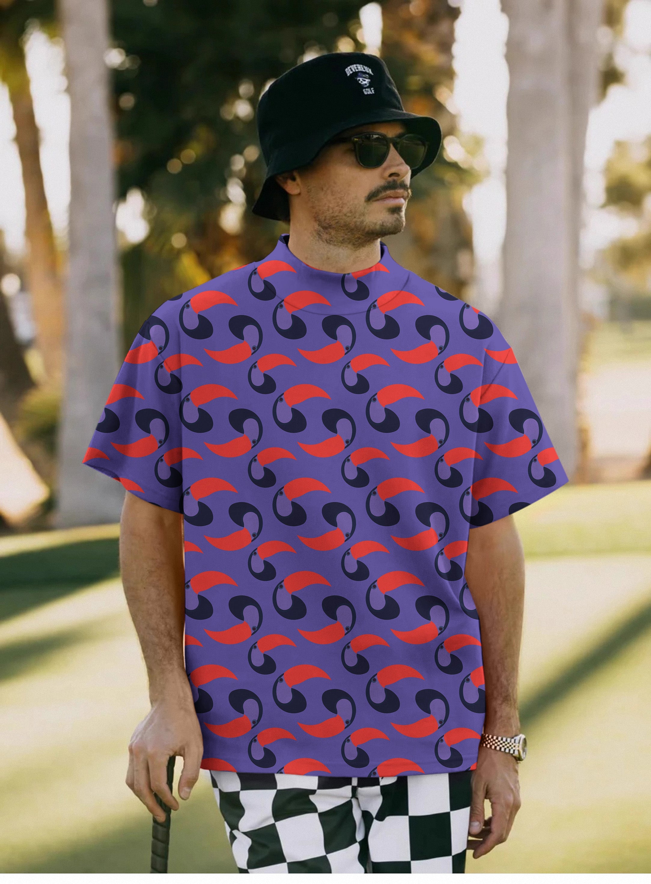 Men's purple toucan pullover t-shirt with high neck and short sleeves worn outdoors