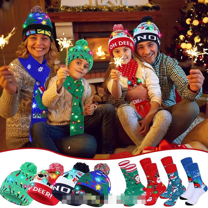Family wearing colorful Christmas knitted hats and scarves indoors with festive fireplace background and holiday decorations