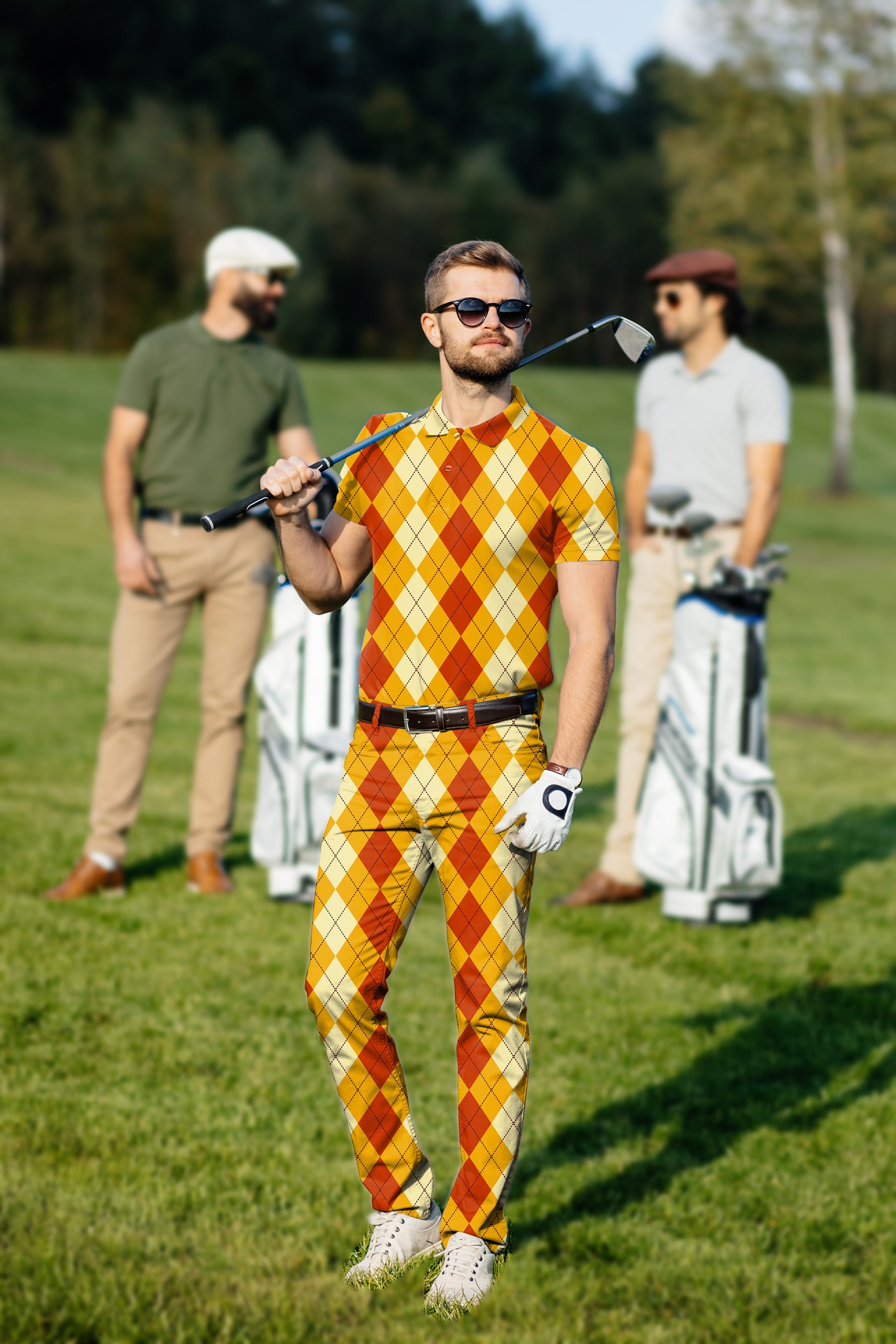 Men's golf set with Halloween light yellow red argyle polo and pants on a golf course