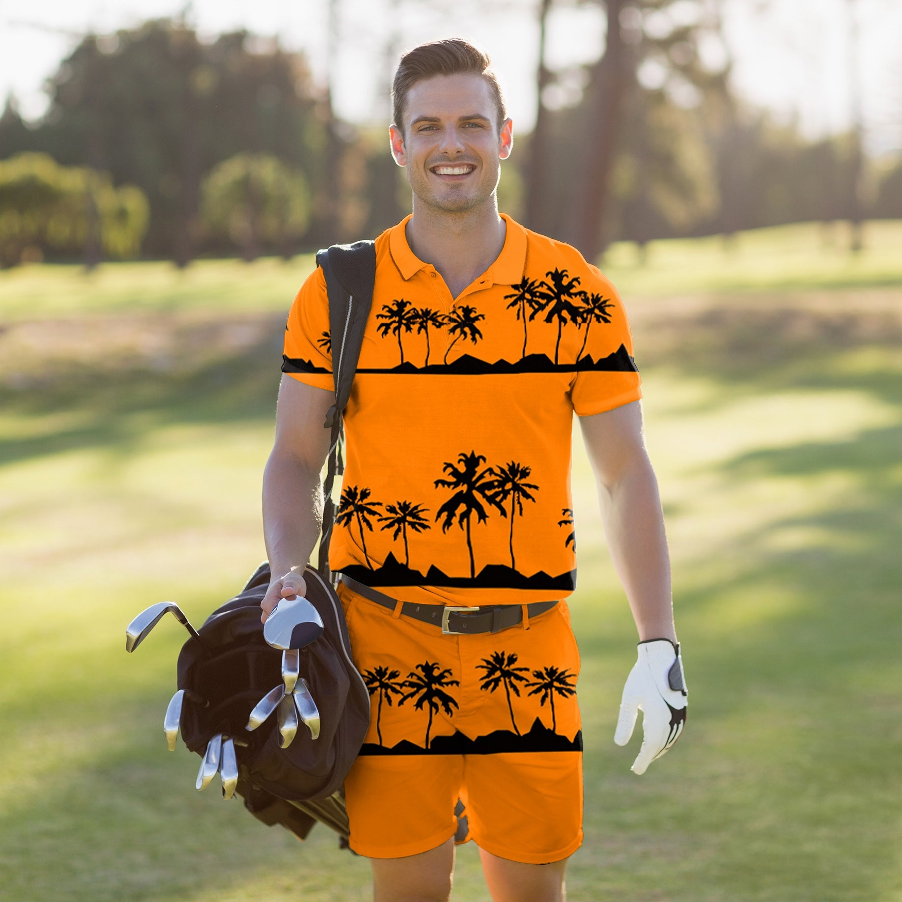 Men's golf set polo and shorts with setting sun and coconut tree design on a sunny golf course