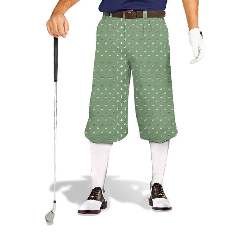 Grass green anchor-patterned men's golf knickers with snug ankle cuffs, soft breathable fabric, wrinkle-resistant material, and adjustable Velcro waist.