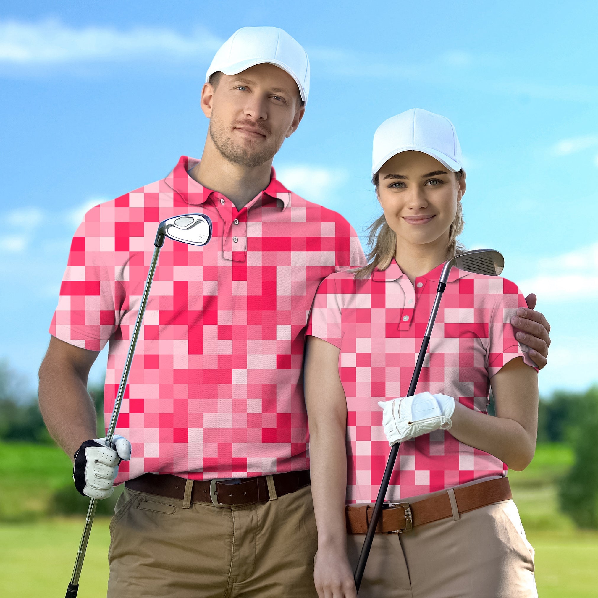 couple wearing light red pixel pattern golf shirts with white caps holding golf clubs on course