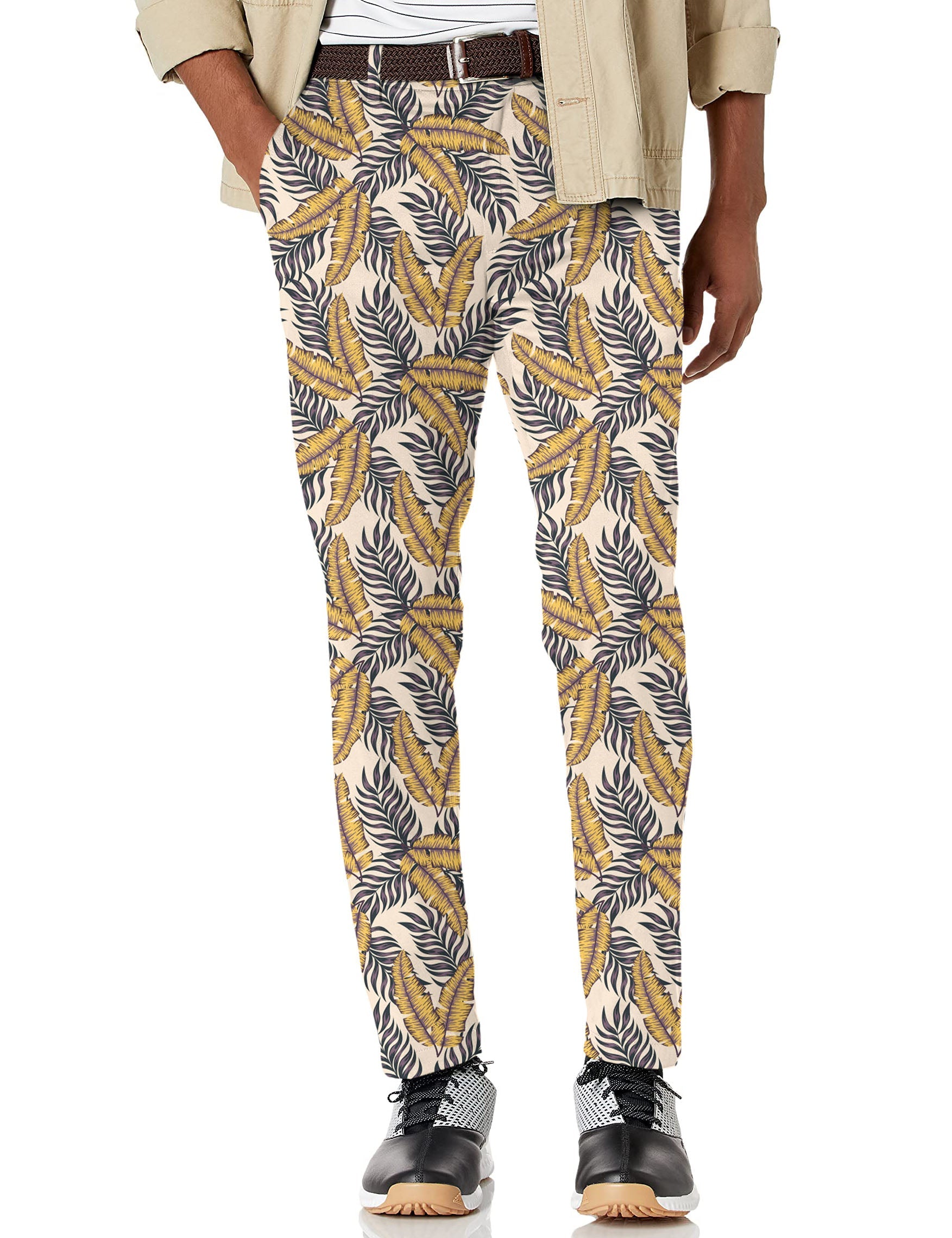 Men's Golden Tropics stretch golf pants with yellow and black tropical leaf print and moisture-wicking fabric