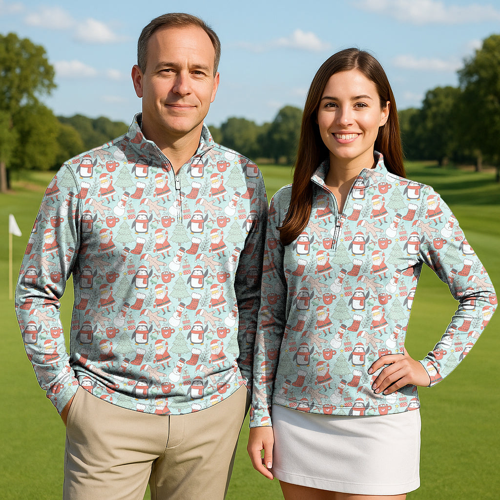 Couple wearing Penguin Christmas Couple Golf 3/4 zip active tops with penguin holiday print on golf course