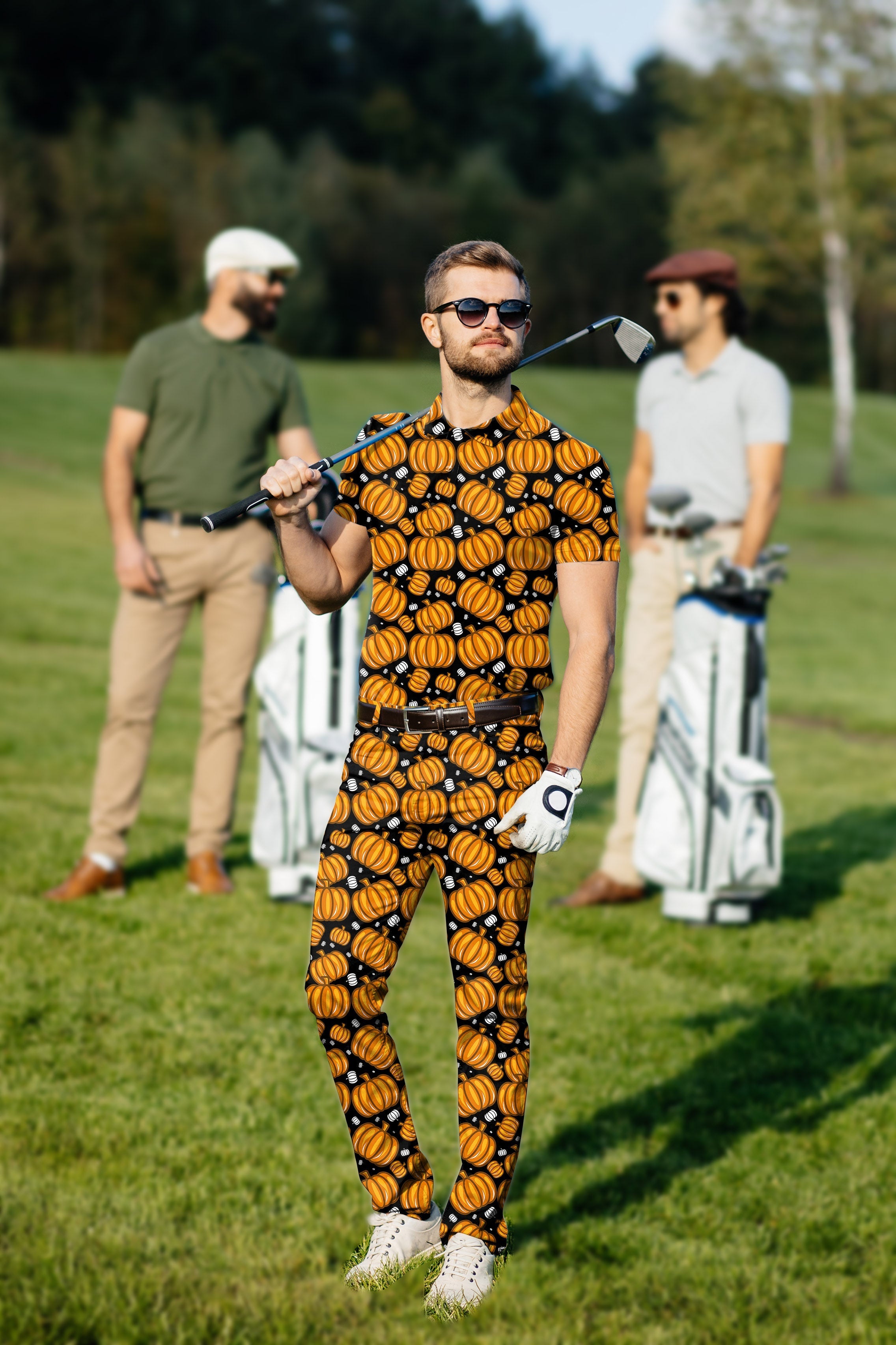 Men's golf set with Halloween pumpkin print polo and pants on golf course