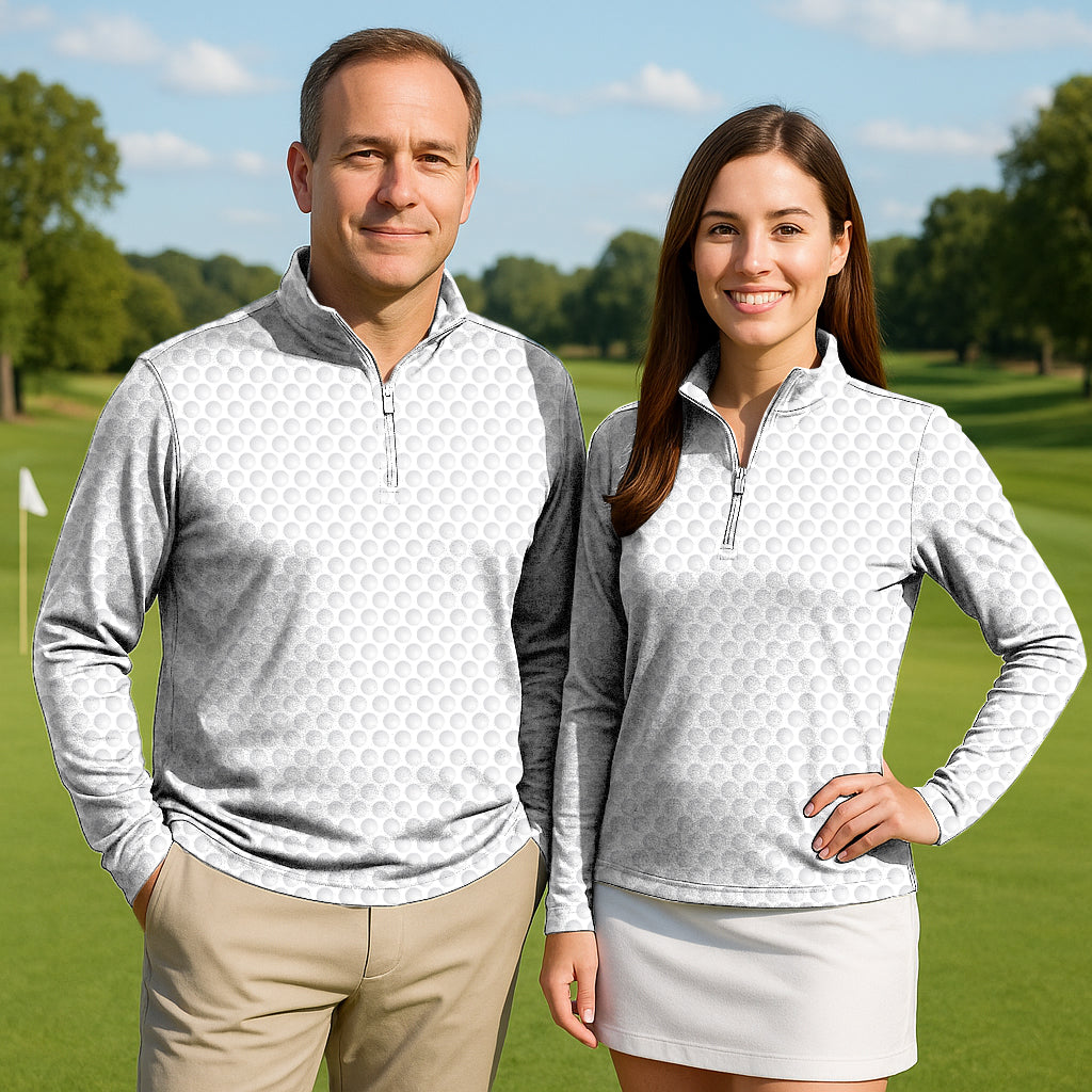 Couple wearing Golf Ball patterned active 3/4 zip tops on golf course