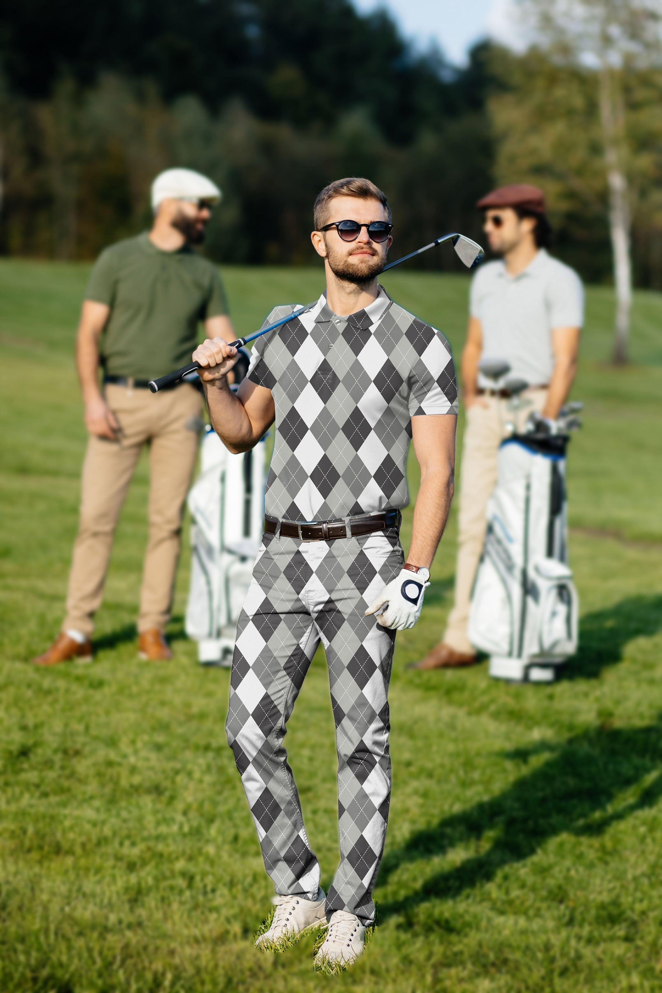 Men's golf set with grey argyle polo and pants on golfer at golf course