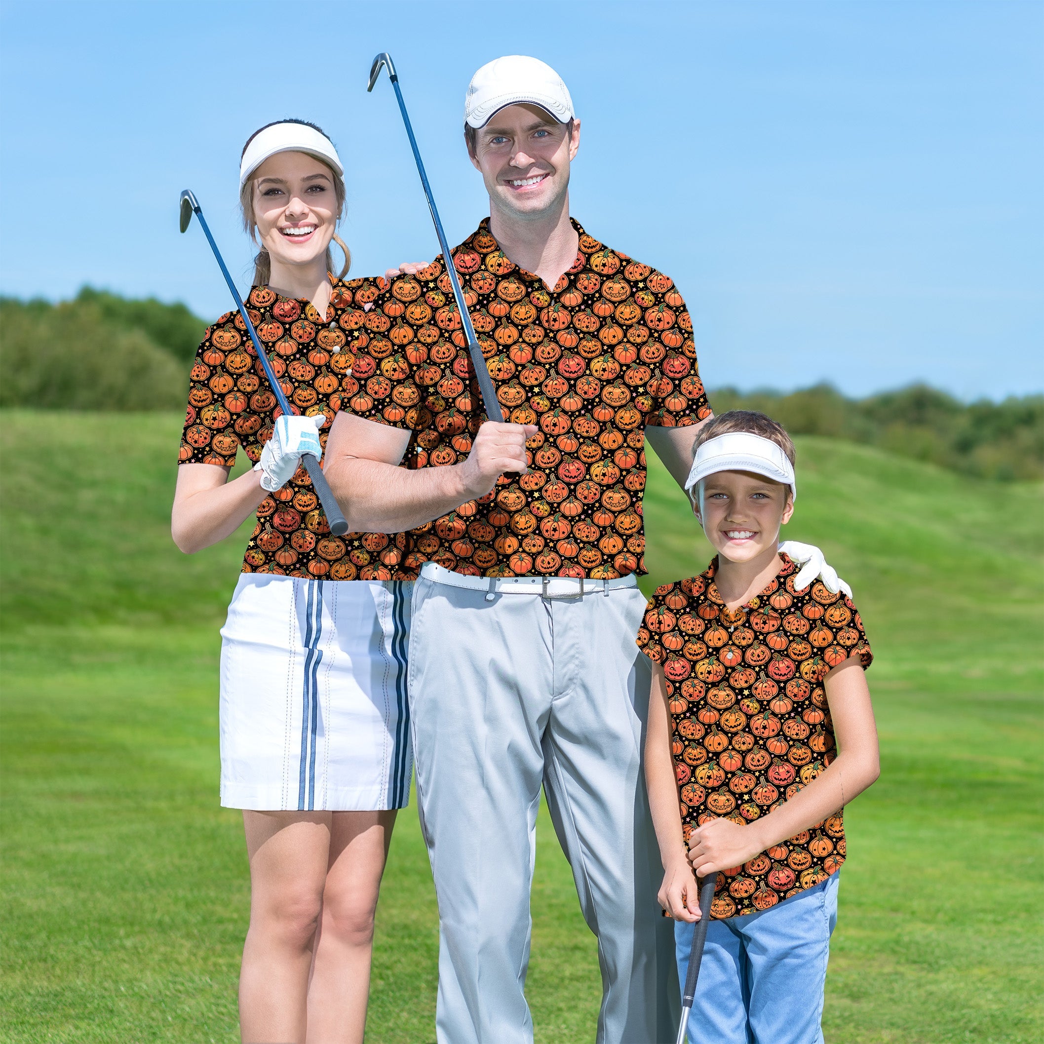 Family wearing matching Halloween star pumpkin golf shirts on a golf course