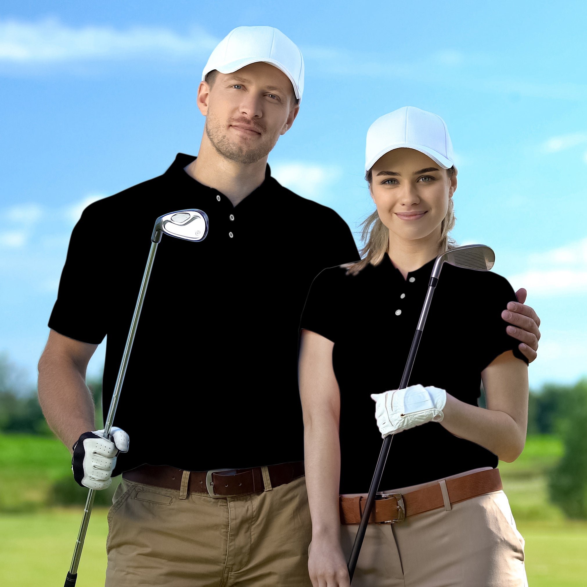 couple wearing pure black set golf shirts with white caps holding golf clubs on course