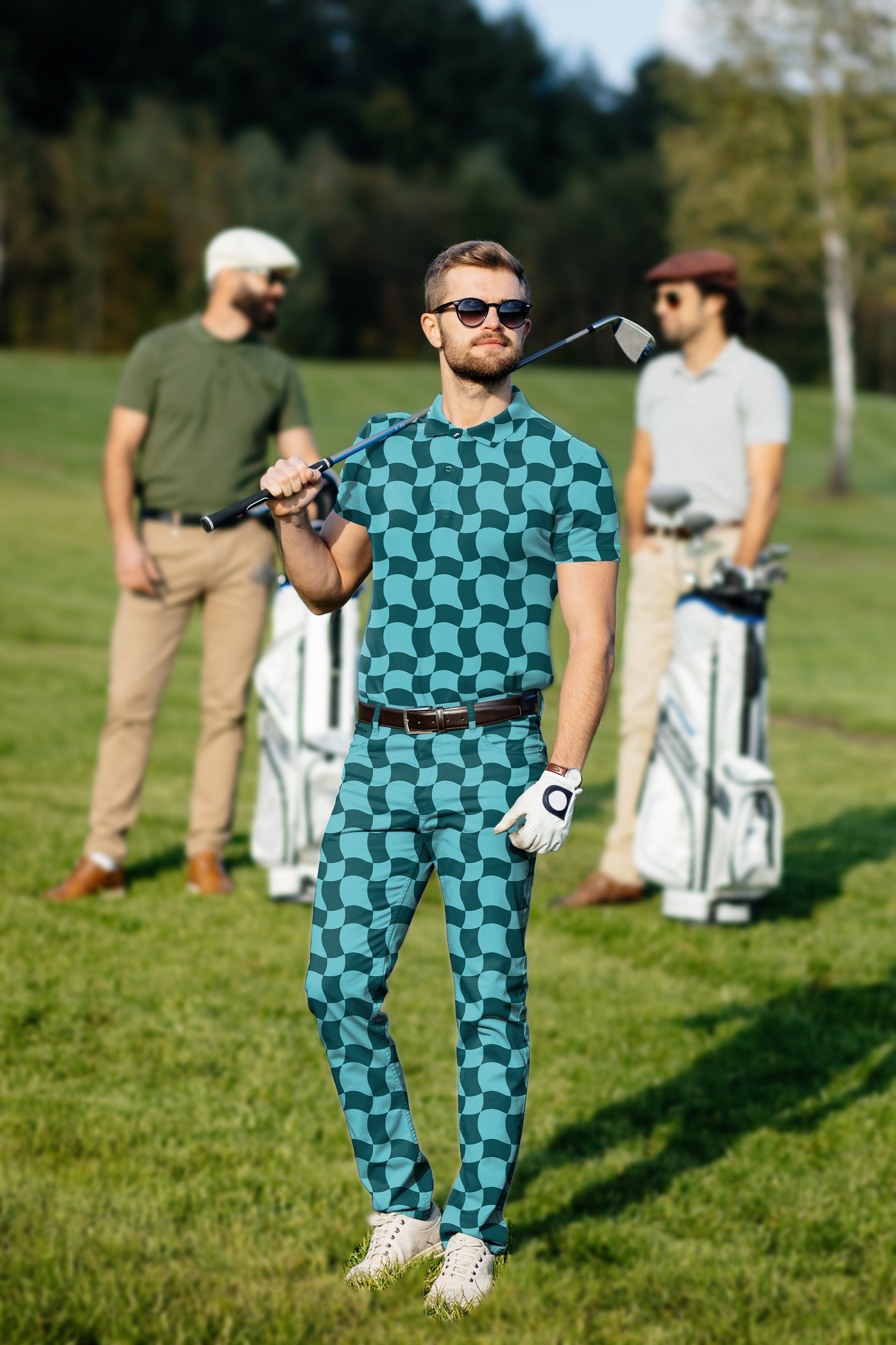 Men's golf set polo and pants with wavy square pattern, four-way stretch, moisture-wicking fabric, and classic fit on a golfer on the course
