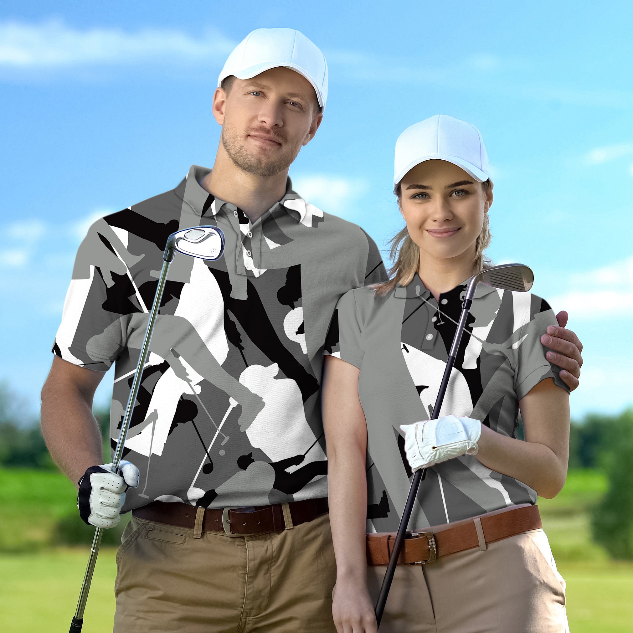 Couple wearing black and white golf set with camouflage design holding golf clubs on golf course