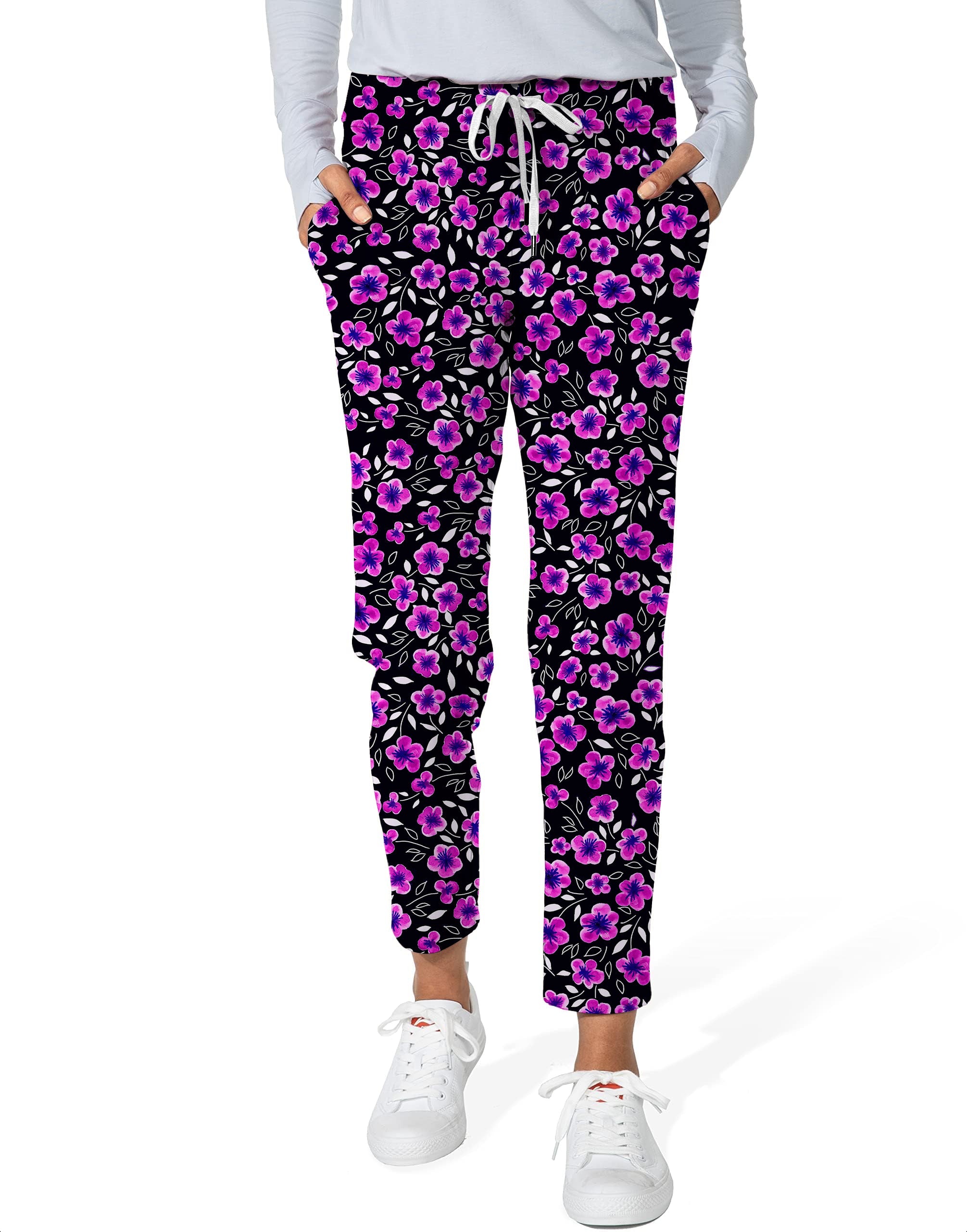 Floral Out-Women's 7/8 stretch ankle golf pants with pink and purple flowers on black background