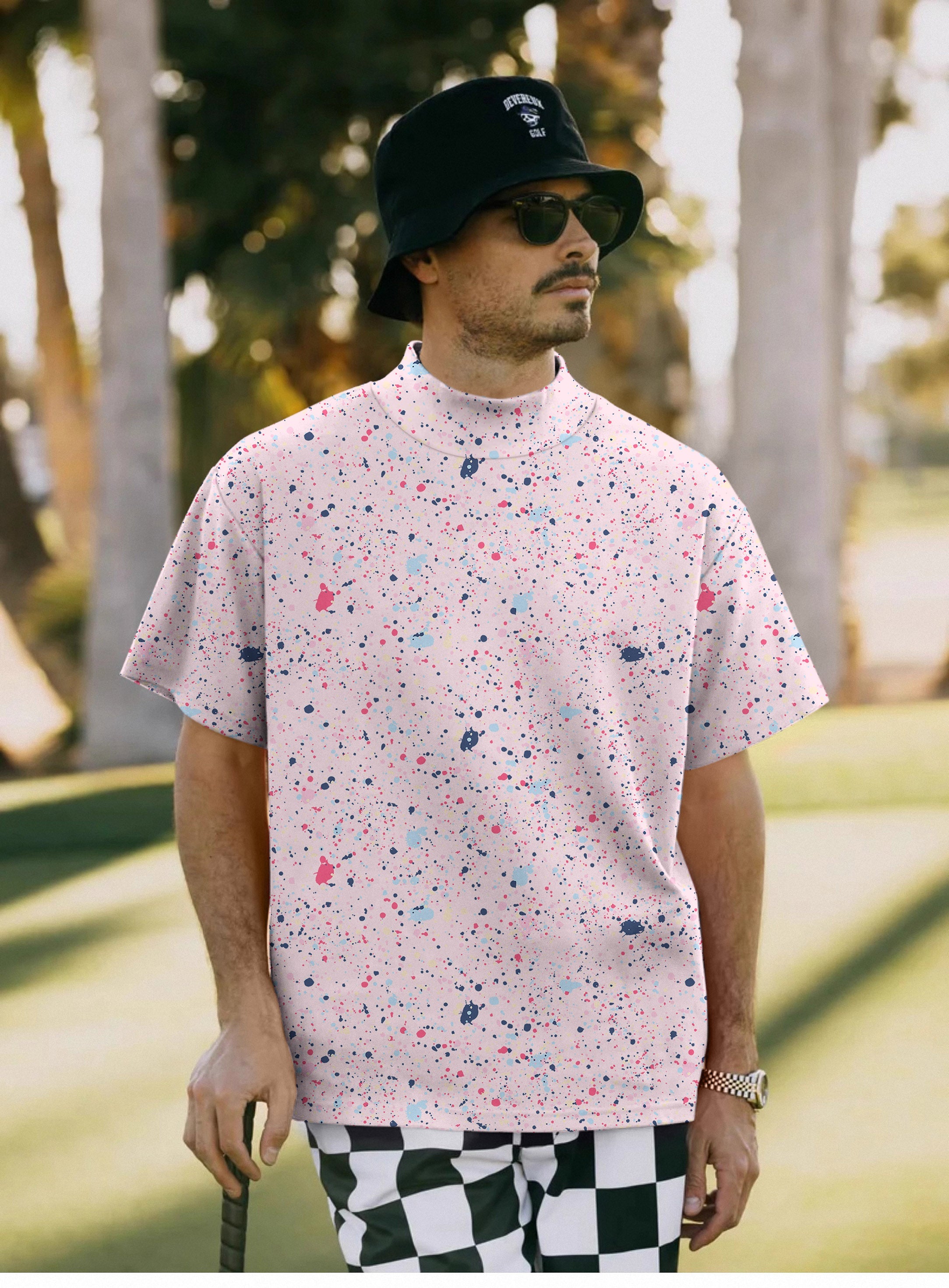 Men's black pink ink dots pullover high neck short sleeve t-shirt on male model outdoors