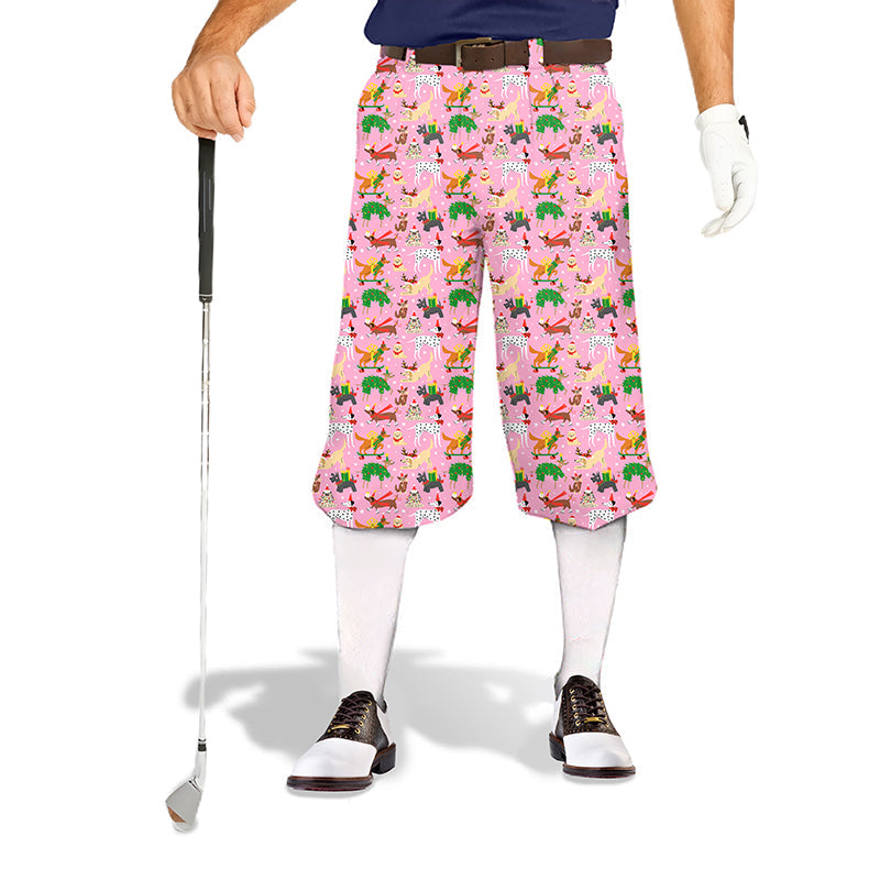 Men wearing Christmas dog themed golf knickers pants with snug ankle cuffs and pink festive design holding a golf club