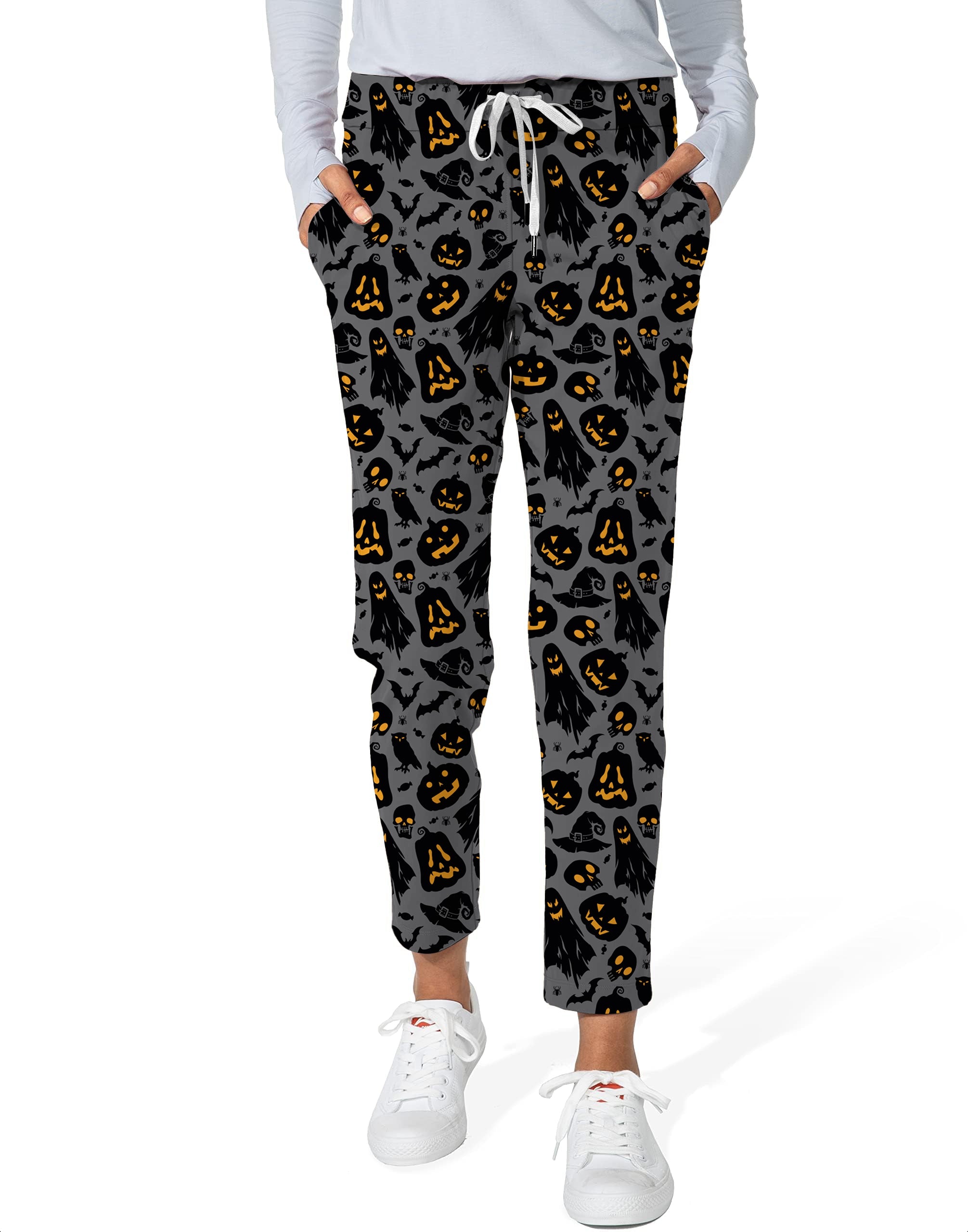 Spooky Halloween-themed women's 7/8 stretch ankle golf pants with jack-o'-lantern and ghost print