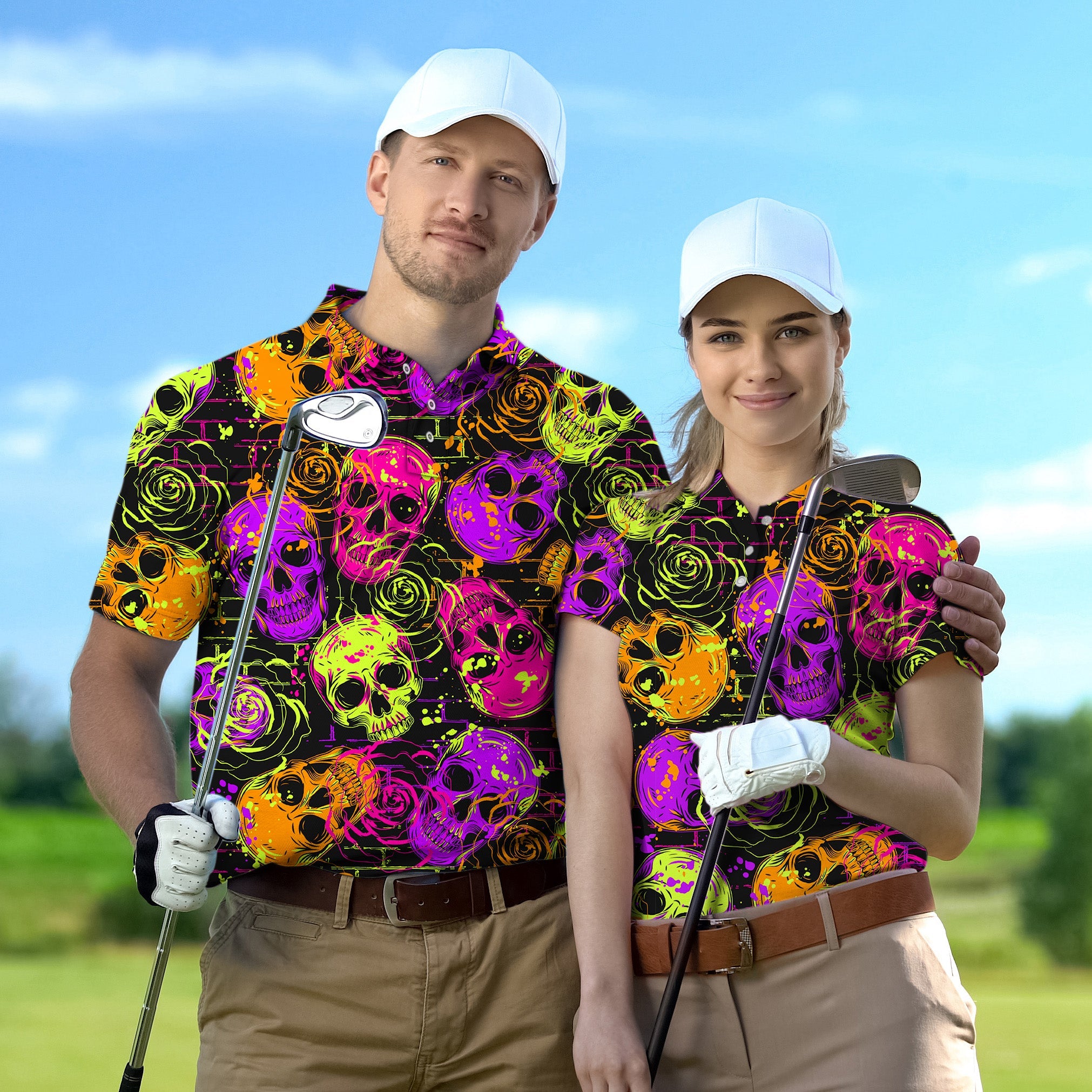 Couple wearing vibrant Halloween colors skull golf shirts holding clubs on golf course
