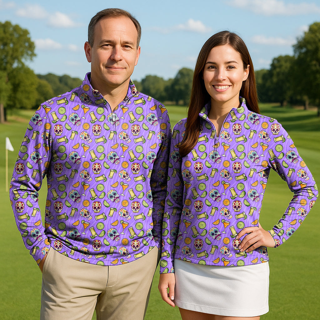 Couple wearing Summer Tequila 3/4 zip golf tops with long sleeves in a colorful pattern on a golf course