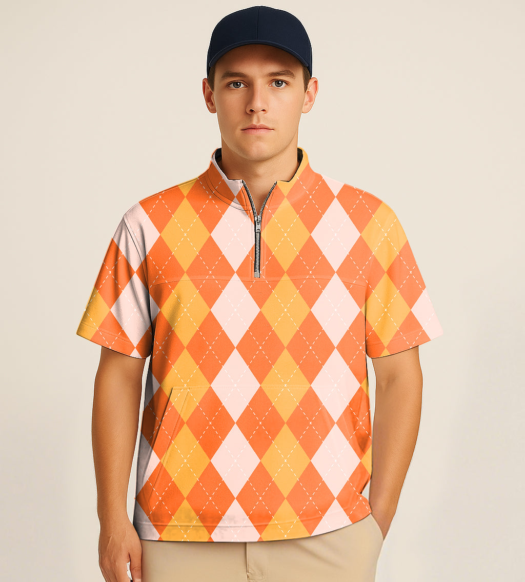 Man wearing half zipper turtleneck golf shirt with orange apricot argyle embroidery pattern