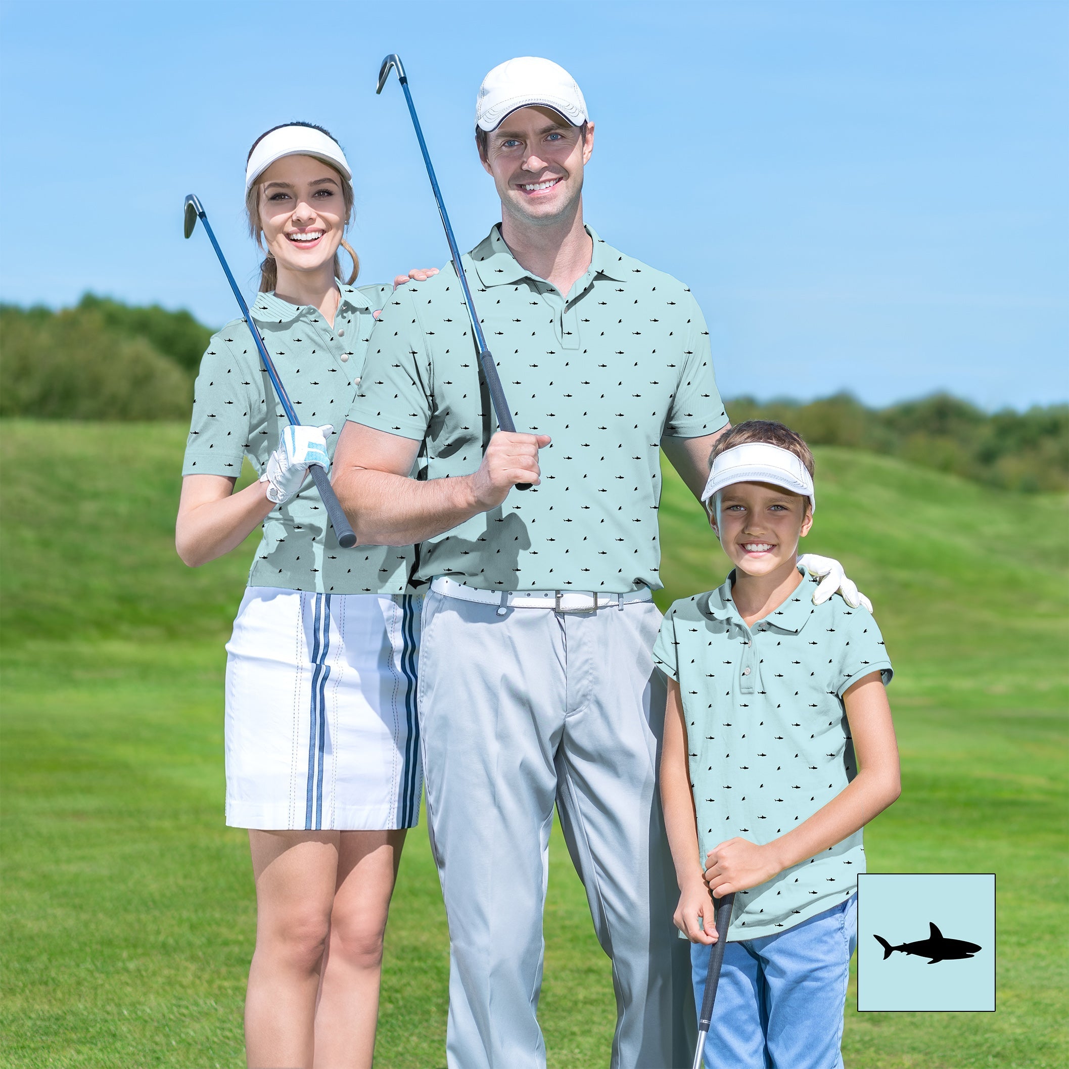 Family wearing matching Black Shark patterned golf shirts on a sunny golf course with clubs