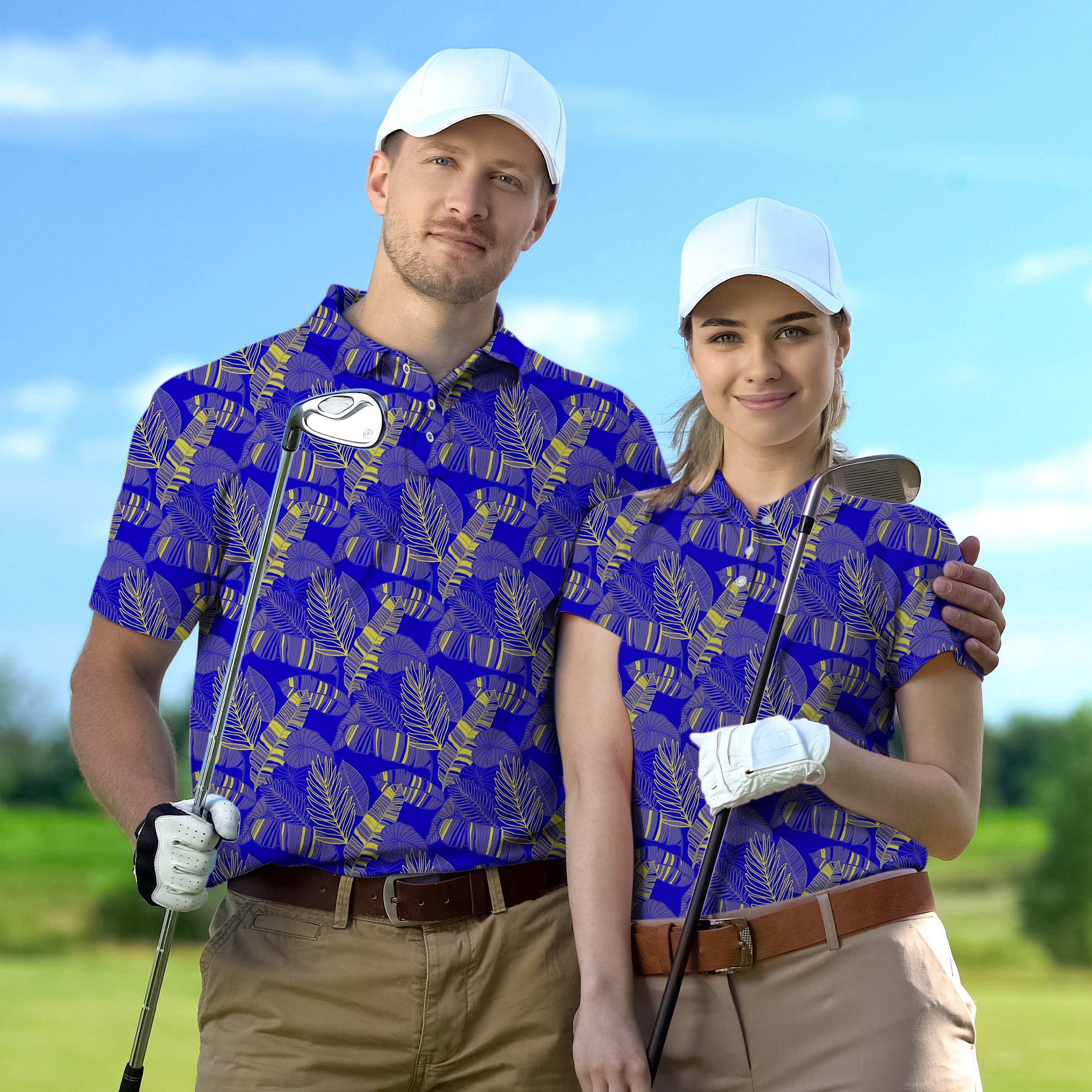 Couple wearing yellow palm print golf shirts with white caps holding clubs on golf course Golf Championship Trophy tournament style