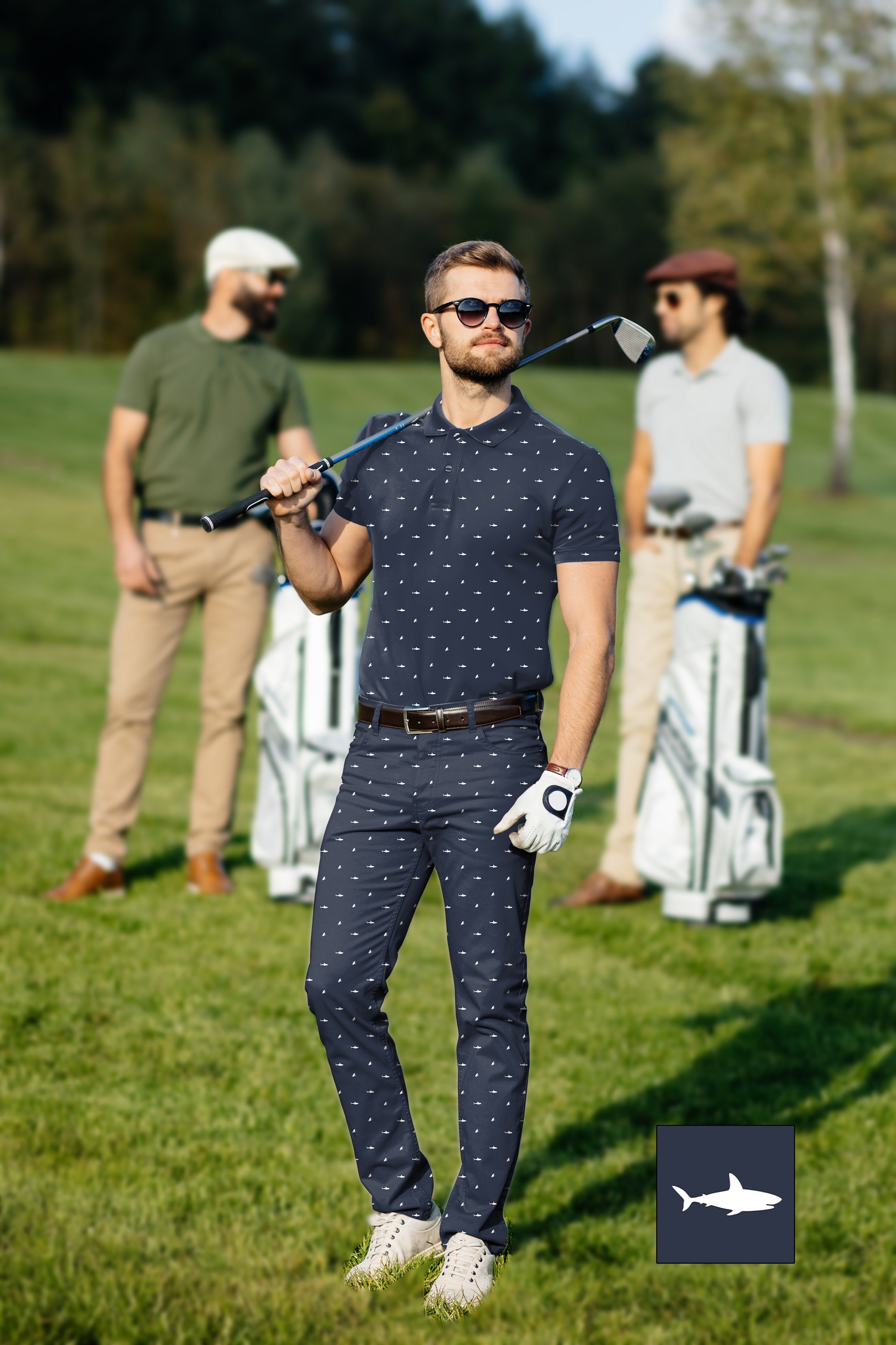 Men's golf set with custom shark and fin print polo and pants on golf course