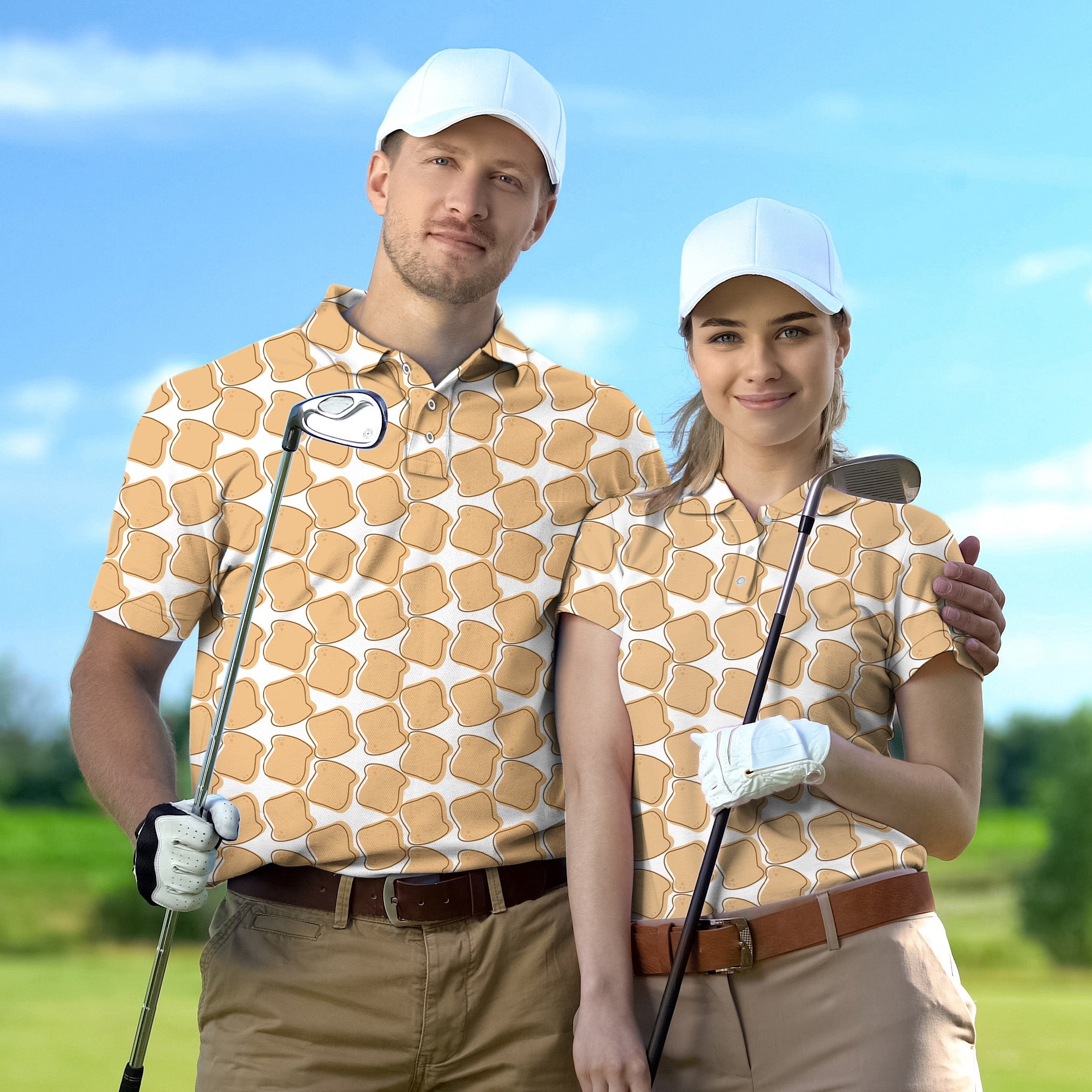 Couple wearing matching bread pattern golf shirts and white caps holding golf clubs outdoors