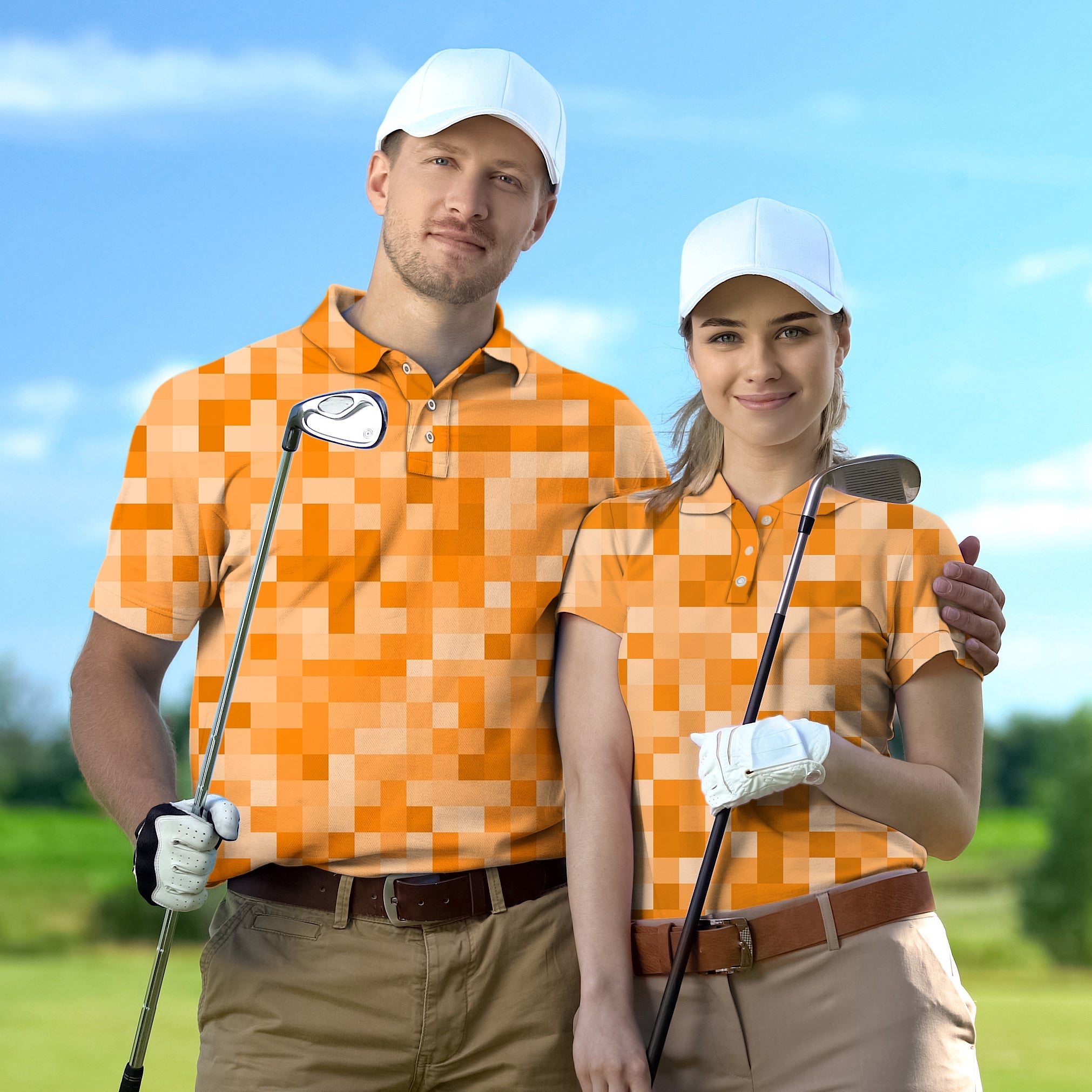 Couple wearing orange pixel pattern golf shirts holding clubs on golf course