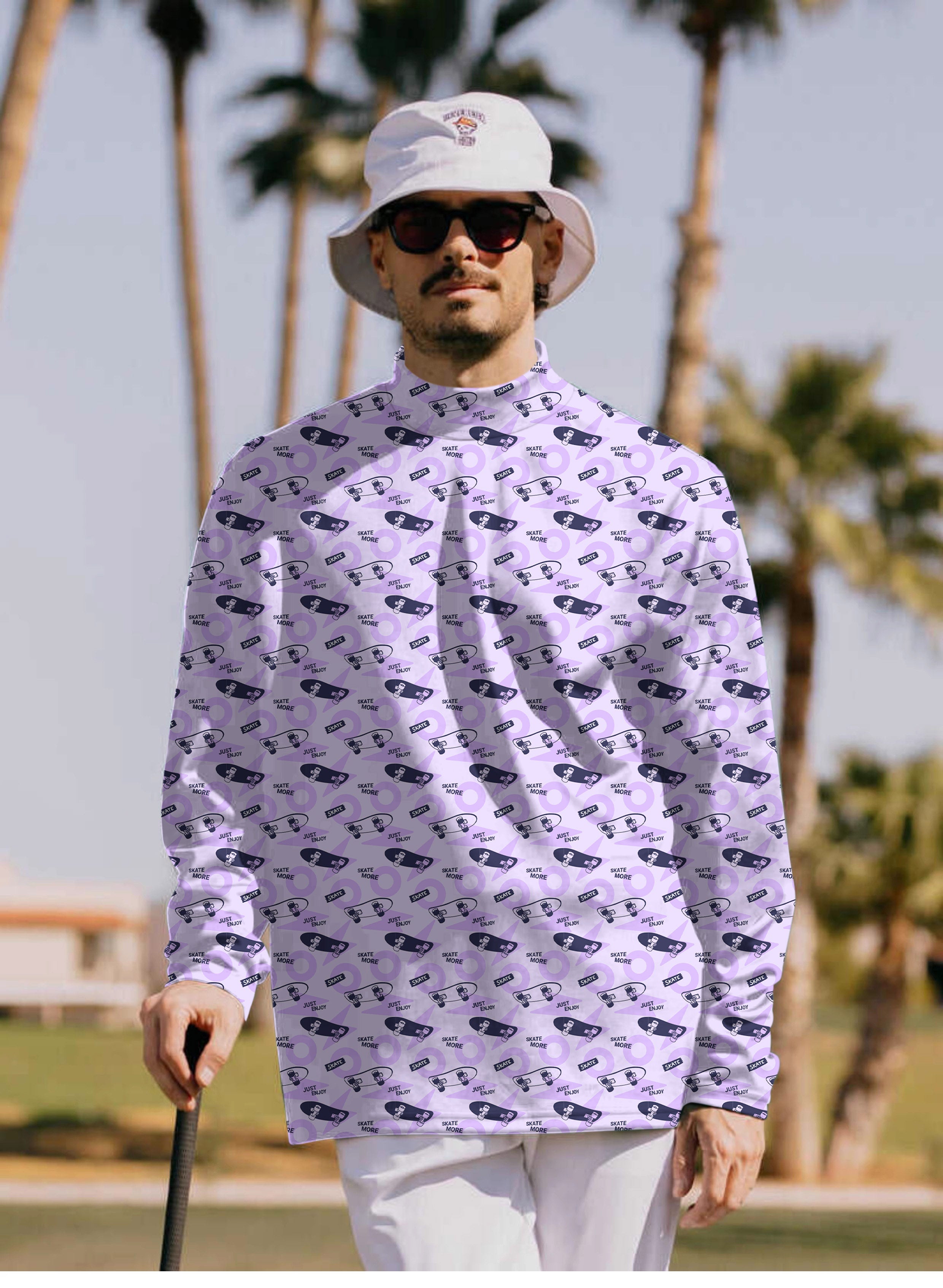 Men's purple long sleeve high neck skate pullover shirt with black skate print and bucket hat worn outdoors