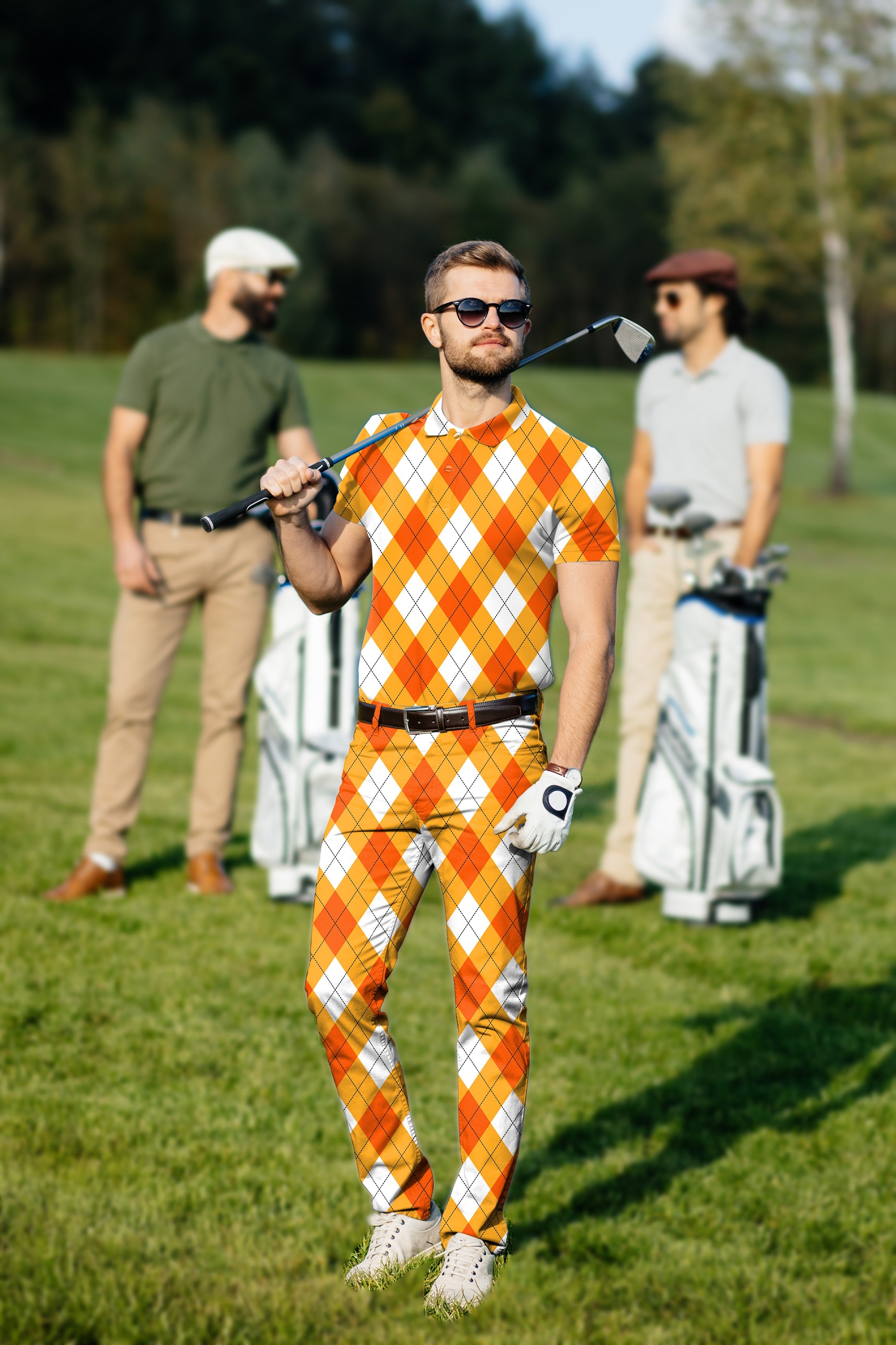 Men's Golf Set with orange white argyle polo and pants on golf course
