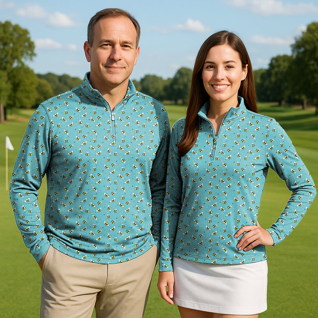 Couple wearing Bumble Bee Couple Golf active 3/4 zip tops with long sleeves on golf course