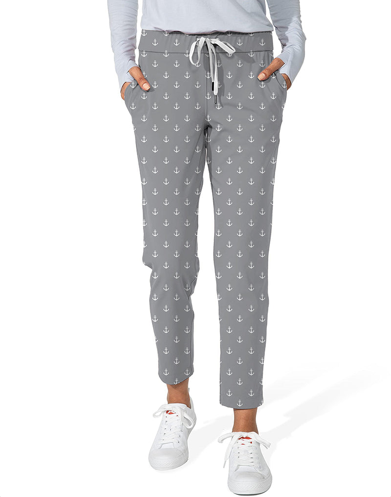 Light gray women's 7/8 stretch ankle golf pants with anchor print, elastic waistband, and side pockets