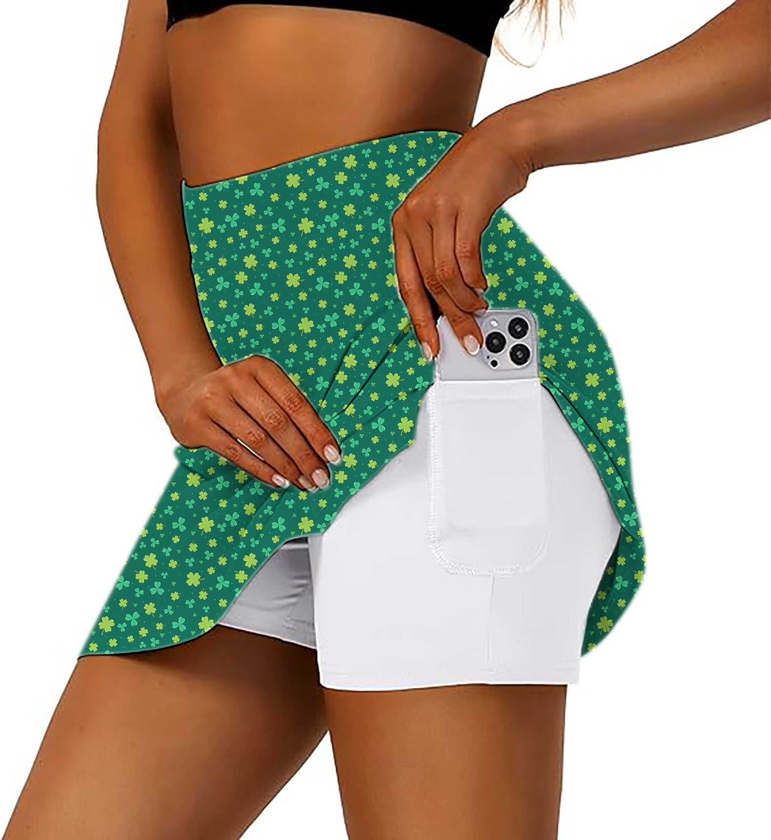 Women's athletic golf skorts with flared green clover skirt and inner white shorts with phone pocket