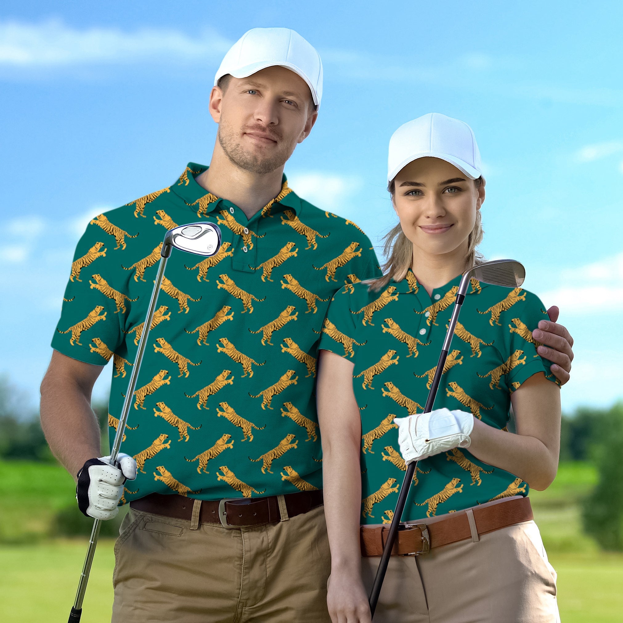 Couple wearing green tiger set golf shirts with white caps holding golf clubs on course